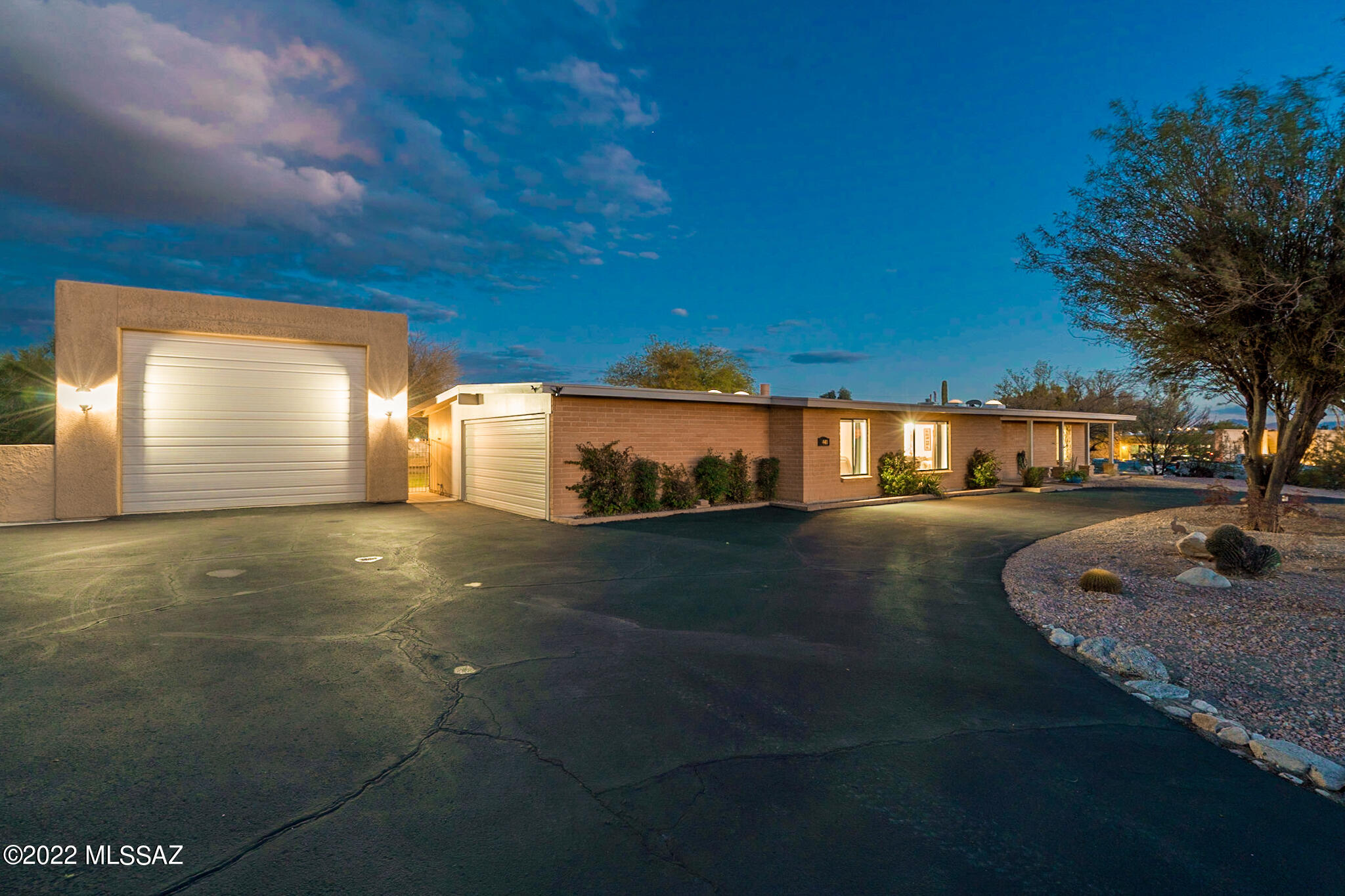 Yes, you can have it all in the Foothills...a huge RV garage/workshop, tastefully updated home, & backyard oasis! The home's interior is open & welcoming, w/tile & carpet throughout, this palette is waiting for your personal touches. The fully remodeled gourmet kitchen has plenty of cabinets & counterspace overlooking the family room w/gas fireplace. Enjoy sunsets from the front living/dining room. The RV garage/workshop has ample storage for rec vehicles, 100-amp panel w/dedicated 240 & swamp-cooler. The extended back patio is perfect for everyday living & entertaining: a refreshing pool & spa, built-in grill & outdoor kitchen & plenty of privacy. Other bonuses: smart home compatible, 200-amp home panel, water softener system, newer HVAC system. This home must be seen to truly appreciate!