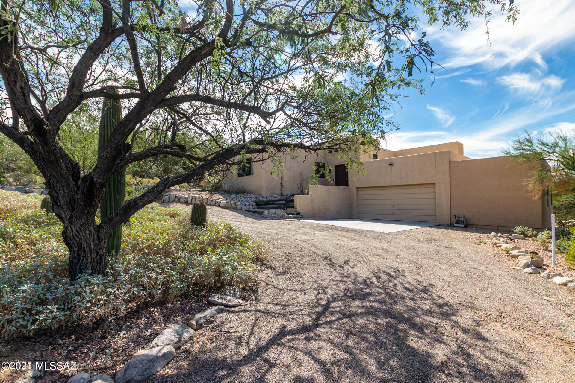Enjoy the beauty and desert serenity in this gorgeous home located in the heart of the Catalina Foothills.  Spectacular views of the Catalinas and the bright city lights.  4BR, 3BA ;with unique
see-thru fireplace in the family room. Updated kitchen complete with granite counters and refrigerator included.  4th bedroom is a great mother-in-law suite with its' own private bathroom. A must see.