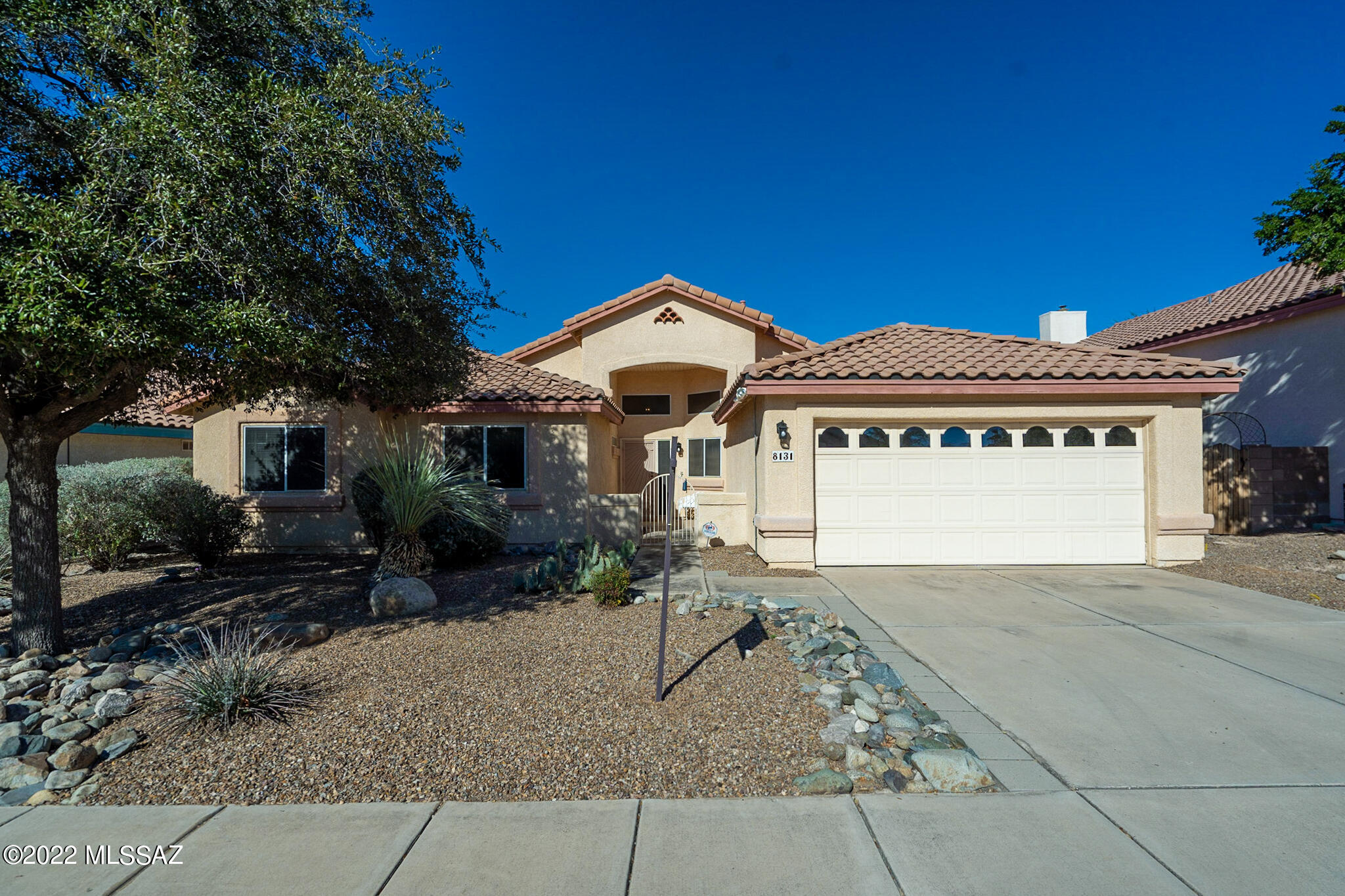 Former Pepper-viner Model. This Lovely Home Has Been well Maintained.  4br/2ba single family resident.  Vaulted Ceilings, Bay Windows, Gas Fireplace In Family Room, Ceramic Tile, Covered Patio. 15 x 15 Screened patio off family room, Backyard w/ built-in BBQ, Catalina mountain can be viewed from the back yard and the living room picture window. Close to shopping and dinning.  Close to Speedway and go to U of A directly. Mature fruit trees and plants in the spacious back yard.