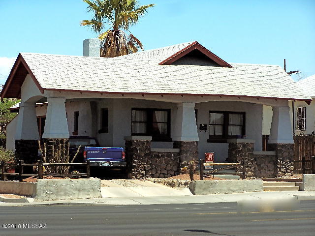 Charming Tucson Historic Feldmans University Bungalow.  Now currently leased until August 2018. Great corner lot for rental or owner occupied home.  U of A campus & stores a few blocks away, hardwood floors, fireplace, newer A/C in 2017 & updated electric 2017.  Large fenced back yard with drip  system, many mature trees & brick pavers, security doors, security bars on windows, security motion lights.  Fresh interior paint in 2017, new double sinks & faucets in bathroom 2017.  Double gates in front of carport for extra parking. Large Basement with electric & lighting, plenty of space & pantry.  Living room with fireplace, desk & bookshelves. Dining room has large counter with many drawers & cupboards for storing.  Great investment property or private home very well maintained.