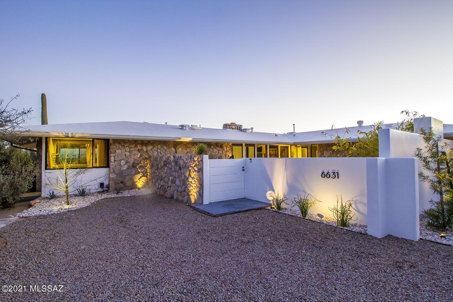 Looking for the most beautiful, one of a kind, stunning home?  Picture resort-like living in Catalina Foothills in this jaw dropping hillside lot home built to enjoy views of the majestic Catalina Mountains & Tucson city scape! Mid-century modern lovers will delight in this designer home in a striking bi-level plan that features the high site. Well appointed interior, gorgeous contemporary kitchen w/ drawer storage, stainless appliances, a unique matte honed granite counter slab w/ bar seating at the cook's counter to take full advantage of the views over the front courtyard of our stunning purple mountain majesty.  Beautifully landscaped with drip irrigation and water cistern and citrus garden. Finished with smooth concrete floors throughout and walls of windows, the property boasts Catalina rock wall accents and gracious living that pours out onto giant outdoor covered porch creating extra living area overlooking the lagoon, pool & jacuzzi, and out to panoramic views of the city, and our spacious skies. Versatile living for the luxury home vacation crave.  Set up a desk and work from ANYWHERE in this spacious light-filled home. Guest wing can become own suite with 2 bedrooms, wet bar + den.

The all new for 1967 ''Executive Home'' in Catalina No. 4 was built by JRW Construction and Investments as a model home for their portfolio.

The house and patios were featured in Phoenix Home and Garden Magazine in 2018. It was also featured on the 2017 Atomic Tucson Modernism Home Tour.