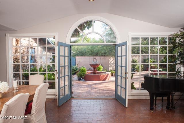 Charm & character not often found in newer homes.Massive great room opens to private rear courtyard ,replete with fountains, mature mesquites, fireplace & covered porch for ultimate Arizona outdoor  entertaining. Redone kitchen and baths, using the finest materials and appliances, incl. Wolf & Subzero. A true cook's dream kitchen & open to Great room. Master w/ adj office or sitting room & FP.  & private patio for the perfect end of day retreat. Premium 3/4 ac cul de sac lot w/ room for pool & guesthouse. Reclaimed water for outdoor irrigation. Brand new roof & insulation 3/10/18. The den/study has multiple office built-ins & attached bath. Large game room with separate entry. Oversized 2+ car gar. Quick commute to hospitals & U of A. Adjacent to new Pantano section of the river bike loop.
