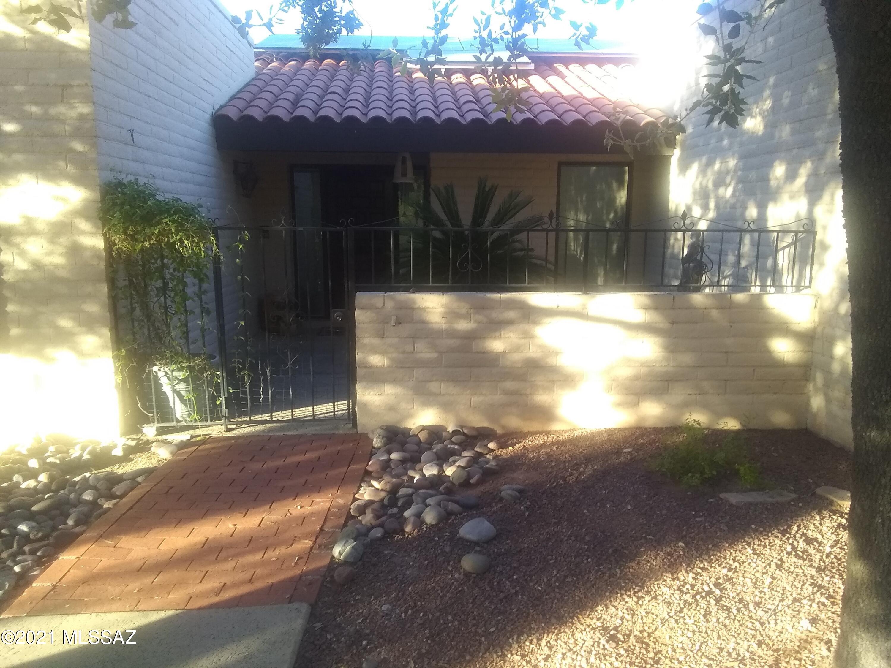 Spectacular patio & garden frame this beautiful home with its soaring ceilings, extensive windows, privacy, comfort and luxury. Ceramic tile,  North wall of great room now mostly dual pane windows (4 yrs. old), all other windows now dual pane & fireplace. Lovingly and meticulously maintained.