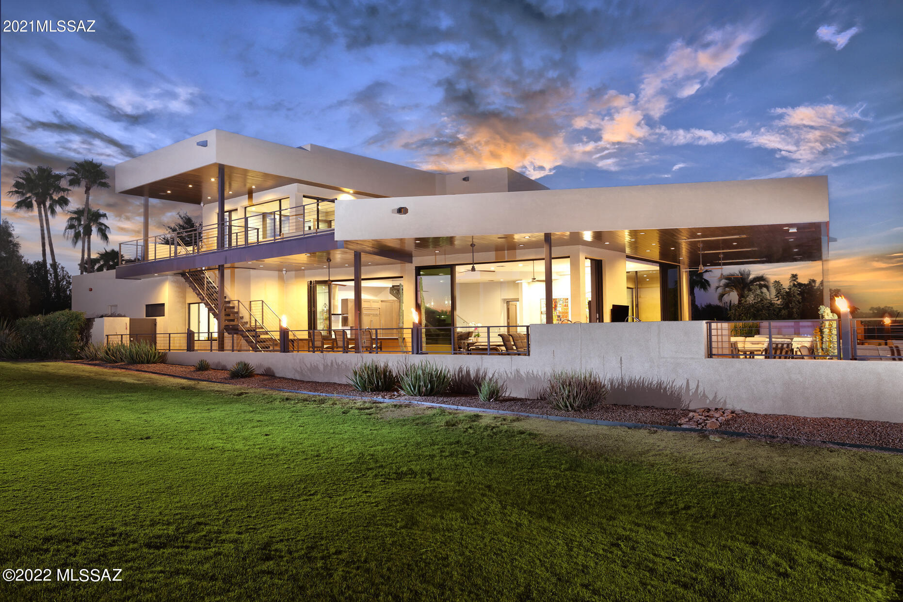 This is a custom home with mountain & golf views.  The award-winning property is located within the gated Omni Tucson National community and was designed by Marc Soloway.  The original home was completely demolished & a new contemporary home built to take advantage of the eastern and western views.  Each space offers unique features and finishes: expansive floor to ceiling stacking sliding glass doors and accordion stacking windows providing an easy flow for graceful entertaining;  polished concrete floors, granite, Dekton and Glassos crystal countertop and much more. Home is easily managed through a Creston Home automation system.  More detail about home and features in Documents. The home was built with a combination of wood and steel frame columns providing strength and durability for the larger roof and floors.