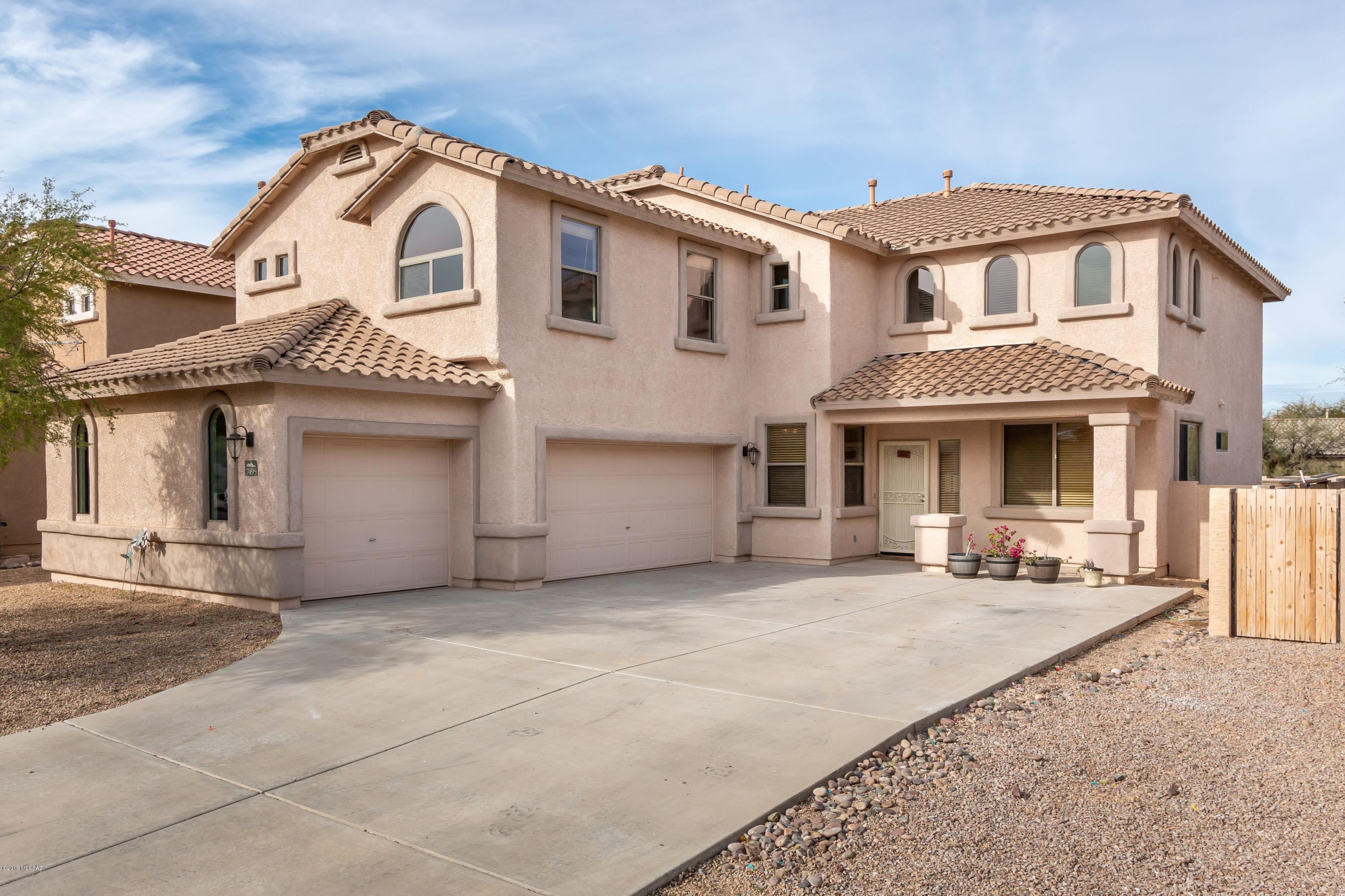 Imagine walking in to this gorgeous home and being welcomed by the high vaulted ceilings and perfectly designed ceramic tile. You will enjoy the large spacious kitchen with granite counters and stainless steel/back appliance. Relax in your over sized pool and spa, while you watch the fireworks on the 4th of July! Private lot backing up to the desert. This home has so much space, including mother-in-law suite downstairs and plenty of rooms upstairs with a bonus room to enjoy all your hobbies and activities. Your master suite is your safe haven where you will find your over sized tub and walk in shower, with a large walk in closet. Plenty of natural light with large windows, solar powered blinds on the tallest windows. Close to parks & library, easy access to freeway and shopping. Come see this home, it is a dream!