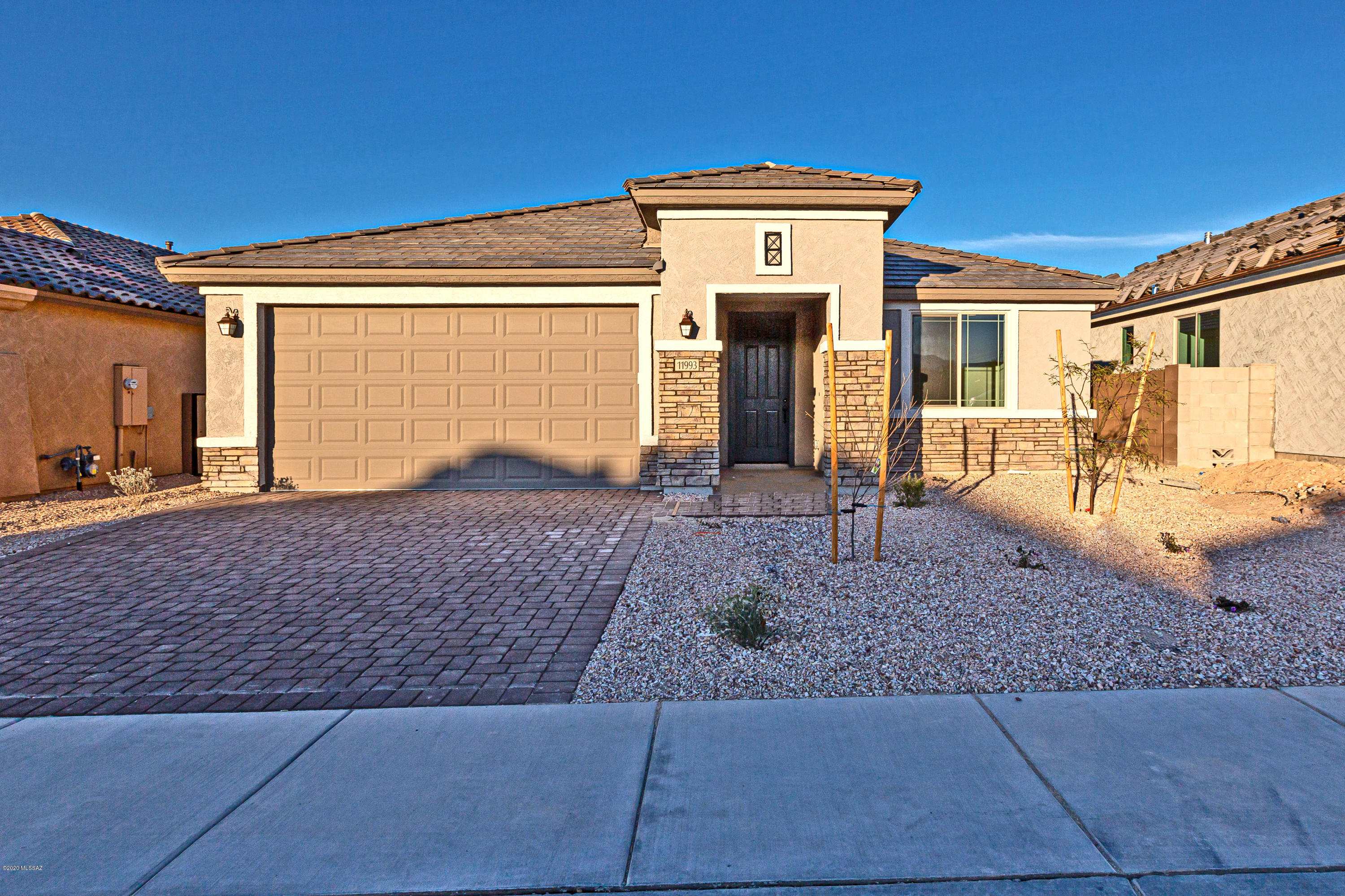 Tangerine Ridge is an all single-story gated community, located near Twin Peaks and Tangerine Rd.  Owner's bath features glass walk in shower, granite countertops in kitchen with Linen Cabinets with dual sinks and huge walk in closet.  Kitchen offers modern appointments such as chef kitchen with stainless steel gas appliances, granite countertops and pendant lights over the island.  The flooring throughout is 12 x 24 porcelain tile in all areas except bedrooms.  Other upgrades include 2 tone paint and pavers on the driveway.