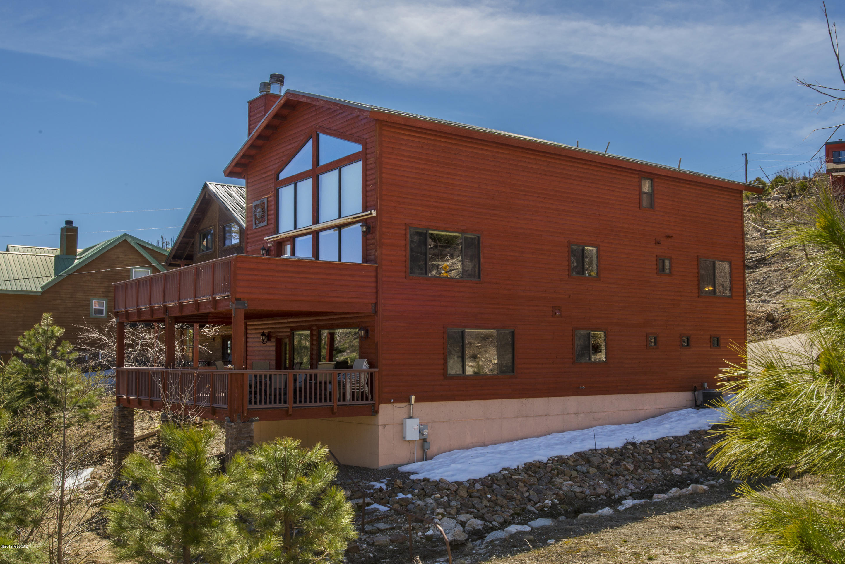 Beautiful Luxurious mountain cabin loaded with amenities with year around access.This is a 4 bedroom 3 bath with a 2 car garage with its own work station. Mud room in entry way for snowy days.Large open living room with electric window coverings.Master suite with its own fireplace and an open loft on top floor for possible office space.Master bath with a jetted bath tub and separate shower.Large media room on the bottom floor with a full wet bar and its own deck.2 Large Trex decks for easy maintenance and a built in gas BBQ on main floor deck,perfect for gathering on beautiful mountain days.Cabin has an alarm system,surround sound,central vac.Located behind the Living Rainbow,perfect location for walking distance to the village and Marshalls Gulch.Come up and check out this stunning cabin!