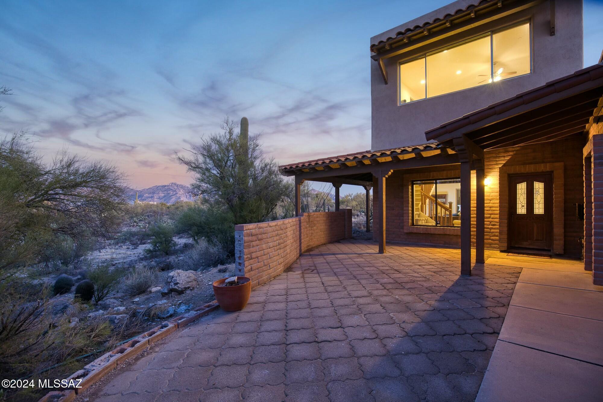 Nestled on a serene 4.75-acre lot in La Cholla Airpark, 13475 N Lindbergh Drive, offers a tranquil escape with a blend of rural charm and modern convenience. This 3,174 Sq Ft home features three bathrooms, open living spaces, and potential for personalized upgrades. Built in 1988, the highlight of the property is the 2,400 Sq Ft hangar/barn garage that can accommodate anything from your plane to your car collection. A separate bathroom and storage area within the hangar provide flexible options for the substantial space.

At La Cholla Airpark, residents live with their planes, horses and abundant wildlife around a 4,500 Ft paved and lighted runway. The Airpark is 20 miles northwest of Tucson, AZ and set on 1.5 sections, or about 1,000 acres. La Cholla Airpark is a private residential airpark; the runway is for the use of residents and their guests. A fantastic rural lifestyle, including horses, with shopping and schools nearby. Wildlife is abundant, with frequent sightings of Deer, Javelina, and Harris Hawks.

The home has 3 bedrooms, 4 bathrooms and an additional bonus/activity room with 360-degree views of stunning desert landscapes and mountain views. The backyard area is its own private oasis in the desert, with Palm trees and beautiful starlit skies.

Living in La Cholla Airpark offers a unique lifestyle for aviation enthusiasts and those seeking a blend of luxury and rural charm. This approachable property is an amazing gateway for life in the Airpark. The home sits in the Amphitheater School District with many educational options, with zoning for rural residential use, ensuring privacy and space. Ideal for those seeking expansive grounds and proximity to natural beauty, this property is a rare find in a coveted location.