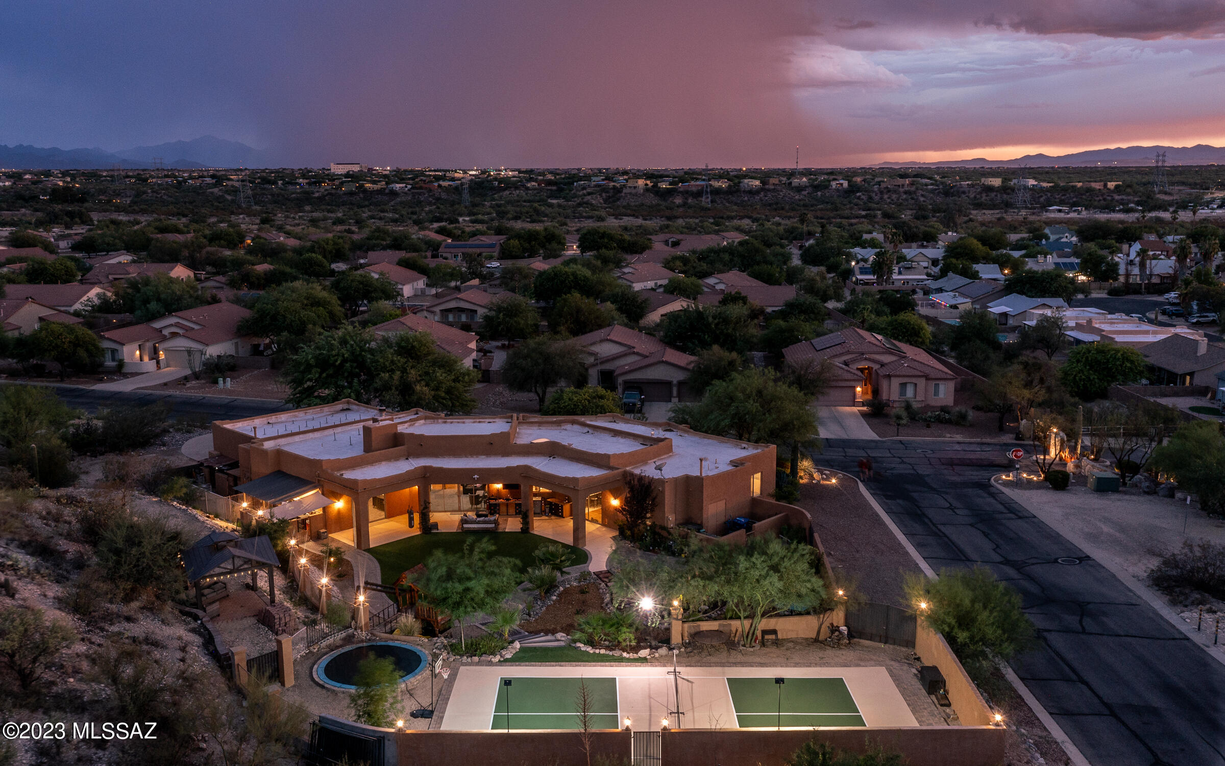 This gorgeous custom home is on an acre  in a gated community! It has so many extras and custom features that it must be seen to be truly appreciated! The entire home has been updated and remodeled including a CUSTOM Kitchen with a huge island, newer paint inside and out and gorgeous flooring throughout the house. The backyard has a lighted PICKLE BALL court and a Gazebo with a sunset view,  just to name a few of the extras this home has to offer! It is the ultimate family and entertaining refuge with plenty of room for all your entertaining wants and needs! This backyard is just waiting for you to enjoy!