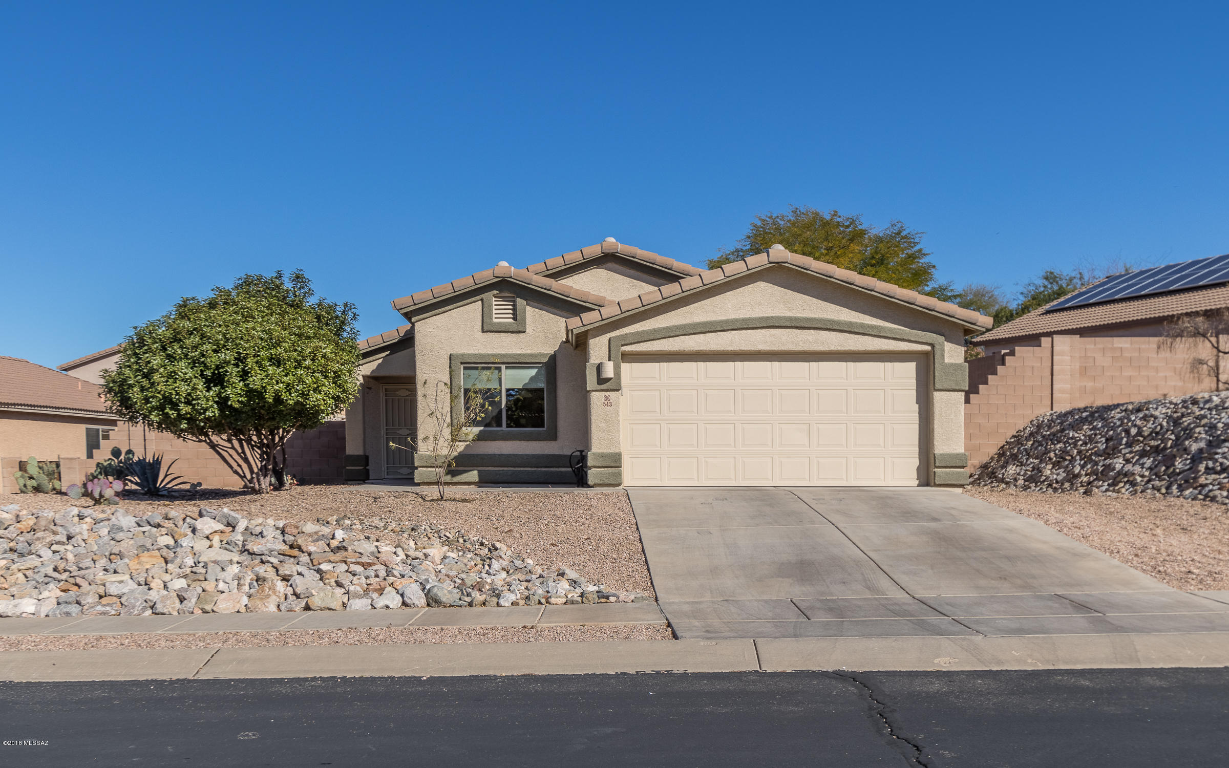 Sunny and Sweet 3 bedroom, 2 full bath, 1,318 sqft, single story, contemporary home in growing Vail, AZ. Kitchen boasts a breakfast bar, plenty of prep counter space, pantry closet and opens to airy breakfast nook. Relax in the Master bedroom with walk-in closet and full bath. Ceiling fans, tile flooring in all the right places, separate laundry room with storage to stay organized. Backyard sports a covered patio with extended flagstone, block fence with high walls for privacy and grassy area on sprinkler system. Attached 2-car garage. A+ school district. Mountain views!