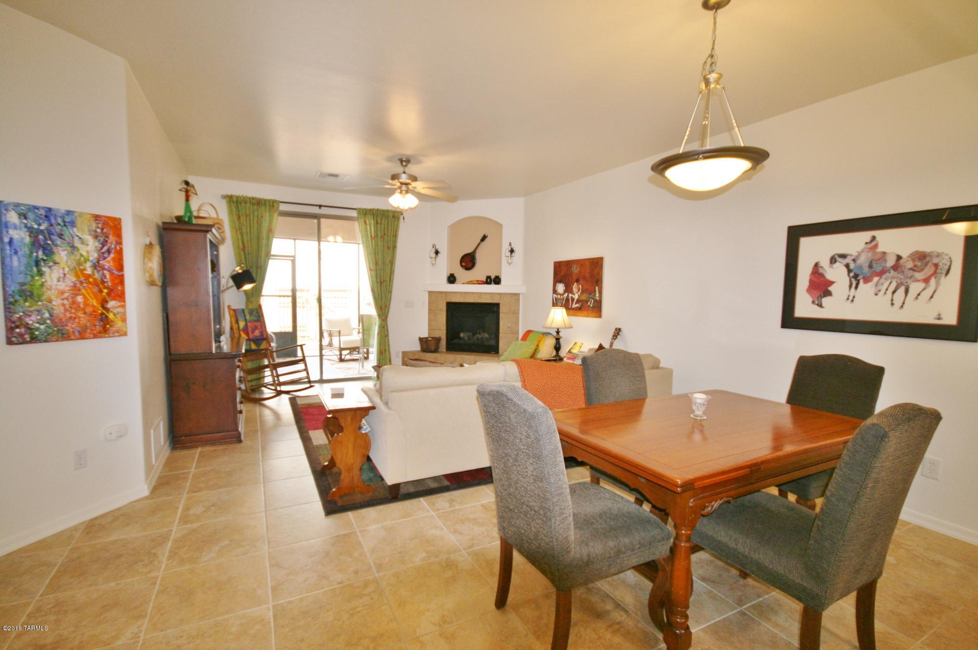 RELAX & ENJOY THIS EASY-CARE RETREAT! Whether sitting by the gas-log fireplace on a winter's eve or in the screened-in porch in the summer's shade, you'll love its neutral paint, all appliances, high ceilings & TILE throughout. If you need a workbench or  storage for bikes, ATVs or golf cart, the extra roomy garage with epoxy floors is perfect. Canyon View's beautiful clubhouse has a pool, spa, games, media & library. Optional Green Valley Rec is available if you decide to join. It offers 13 more rec centers and 1000s of classes in art, ceramics, sports, dance, music, photography, silver & jewelry making, woodworking, computers, games, nature studies, hikes & more. Here you can keep growing, not get get old. How active you want to be is YOUR CHOICE.