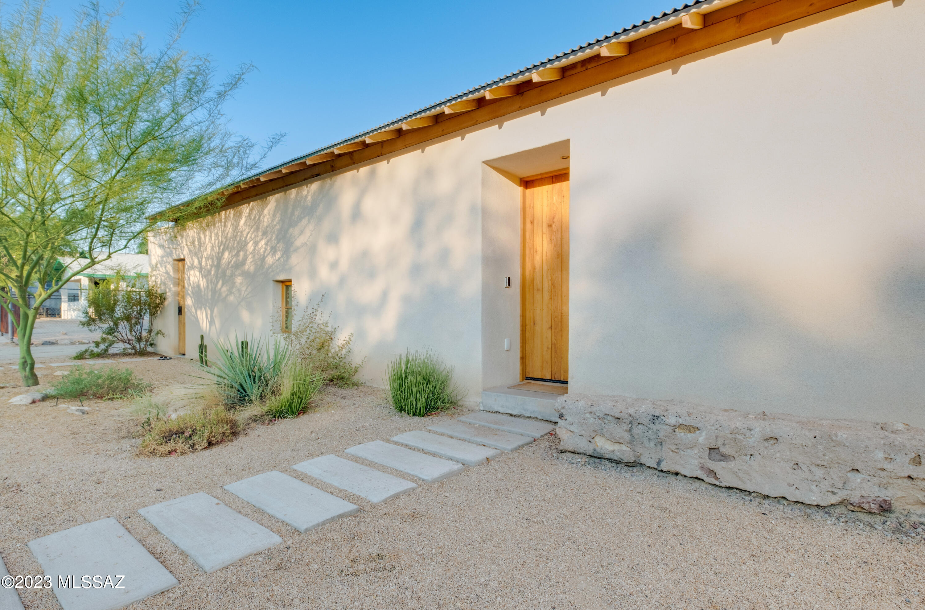Stunning, sophisticated custom home in the heart of Tucson's oldest barrio, Barrio Viejo.  Designed by Studio Caban, built by Paolo Delorenzo, this is a modern masterpiece with an open floorplan, flooded with light.  Three bedrooms and two full baths, huge walk-in closet, recessed lighting and a signature skylight across the kitchen/ great room.  Perfect for entertaining, with huge marble island in the kitchen, Fisher & Paykel gas range and built-in fridge with frameless custom cabinetry. Living areas open to the courtyard, providing lots of light and an indoor to the outdoors feel. Two courtyards provide lovely private outdoor spaces, and the two-car garage features hookup for your Tesla!  Mural by local artist Jessica Gonzales.  OPEN HOUSE Sat 11-2