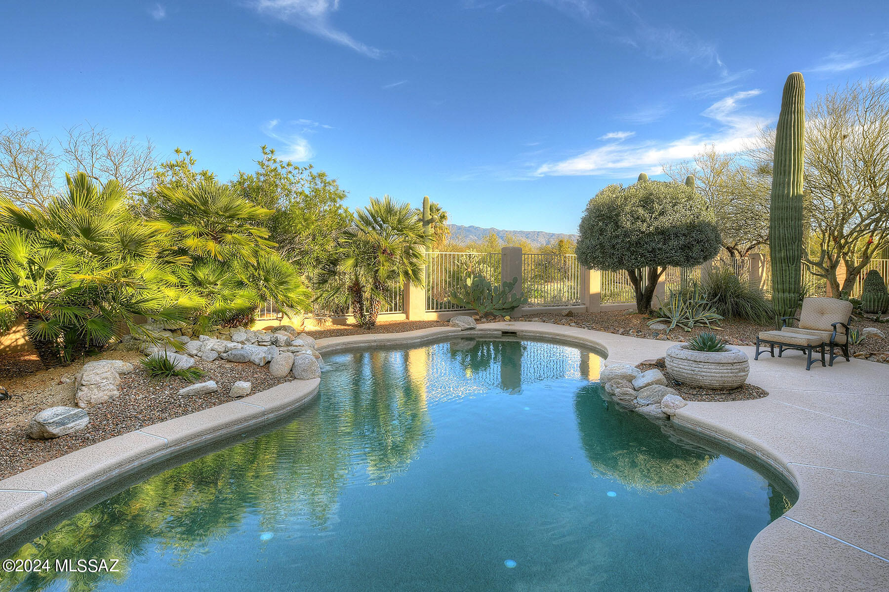 Nestled in exclusive Sabino Springs gated community, this stunning home offers 3 bedrooms, an office, bonus room & 4 FULL bathrooms! Inside discover 3207 SqFt w/split bedroom plan, travertine floors, knotty alder doors, high ceilings, skylights & large windows that capture Magnificent Mountain Views. The kitchen boasts beautiful maple cabinets, granite counters, SS appliances & large island w/gas cooktop & prep sink. Don't miss the gorgeous tongue & groove ceiling in the family room or the amazing primary suite w/spacious closet, jetted tub & French doors to back yard. Step outside to relax by the sparkling pool while taking in breathtaking views, or head out for a round of golf on AZ National Golf Course. 3-car garage too. A perfect mix of luxury, comfort & functionality. Welcome to...9980 E Sabino Springs Place
    						

HOME
"	Sabino Springs Gated Community with Guarded Entry
"	On Arizona National Golf Course
"	Catalina & Rincon Mountain Views
"	Heated Pool
"	Extensive Covered Back Patio 
"	Located at End of Cul-de-sac
"	Flagstone Front Courtyard
"	Custom Entry Door
"	3,807 Square Feet
"	3 Bedrooms and 4 Full Bathrooms
"	Den/Office
"	Bonus Room
"	Living Room with Chevron Tongue and Groove Ceiling
"	Family Room has Gas Fireplace with Floor to Ceiling Slate Tile
"	Travertine Tile Flooring
"	Knotty Alder Interior Doors
"	Recessed Tray Ceilings in Dining Room, Kitchen, Primary Bedroom and Den/Office
"	Skylights
"	Oversized Dual Pane Windows with Blinds
"	Laundry Room with Sink and Storage Cabinets
"	Central Vacuum
"	Water Softener System
"	Water Heater Replaced in 2021
"	.49 acre
"	3 Car Garage with Storage Room
"	Community Amenities include Pool/Spa, Fitness Center, Rec Room and The Grill Restaurant as well as Arizona National Golf Club






 KITCHEN 
"	Open Concept 
"	Maple Cabinetry
"	Granite Countertops
"	Stainless Steel Appliances
"	Oversized Center Island with Bar, Gas Cooktop and Prep Sink
"	Breakfast Nook
"	Recessed Lighting
"	Reverse Osmosis
"	Formal Dining Room


PRIMARY BEDROOM SUITE
"	Large Walk-in Closet
"	Spacious Bathroom with Dual Vanities
"	Jetted Tub
"	Separate Walk in Shower
"	French Doors to Back Yard, Patio and Pool