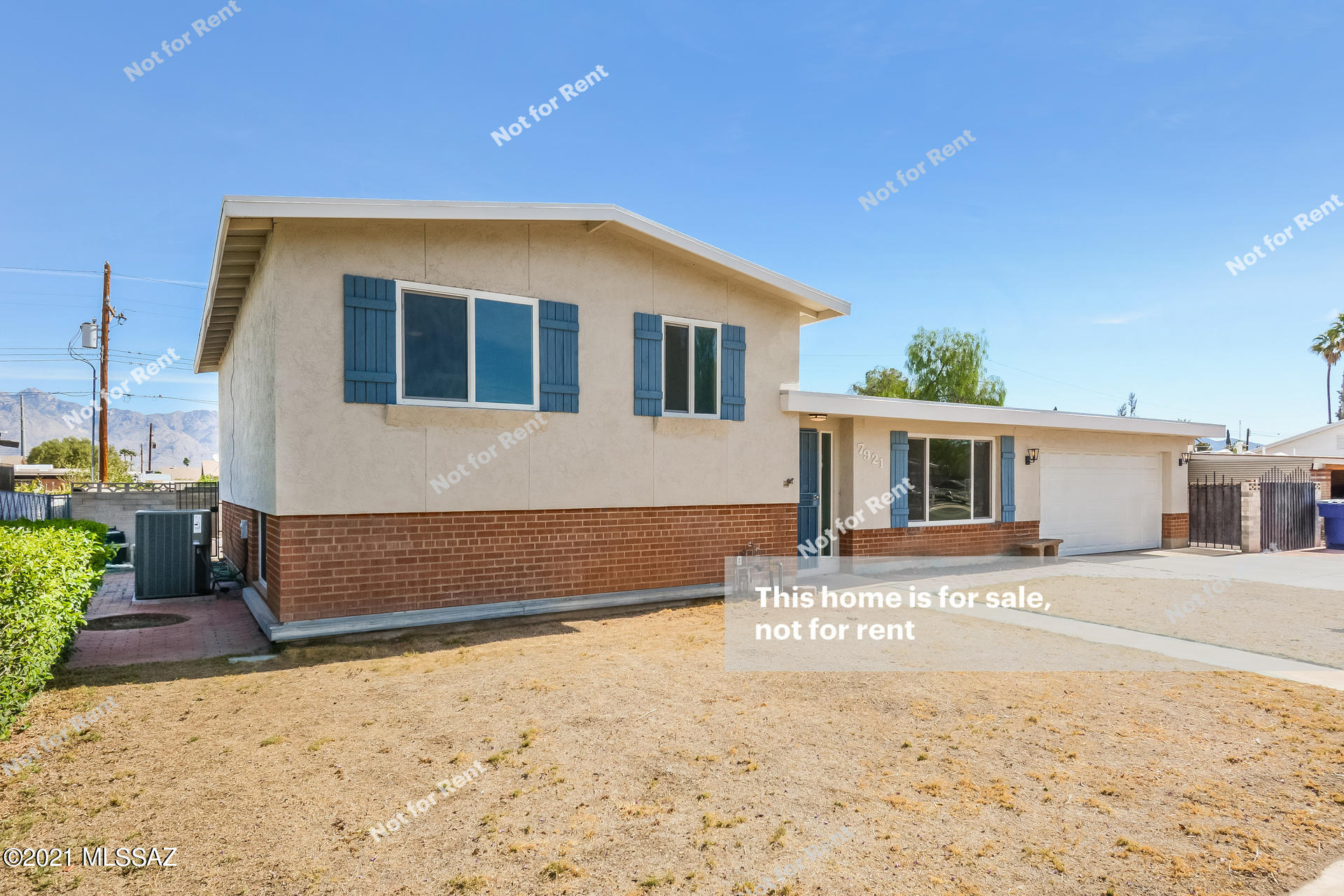 This Tucson two-story home offers an in-ground pool, and a two-car garage. This home has been virtually staged to illustrate its potential.