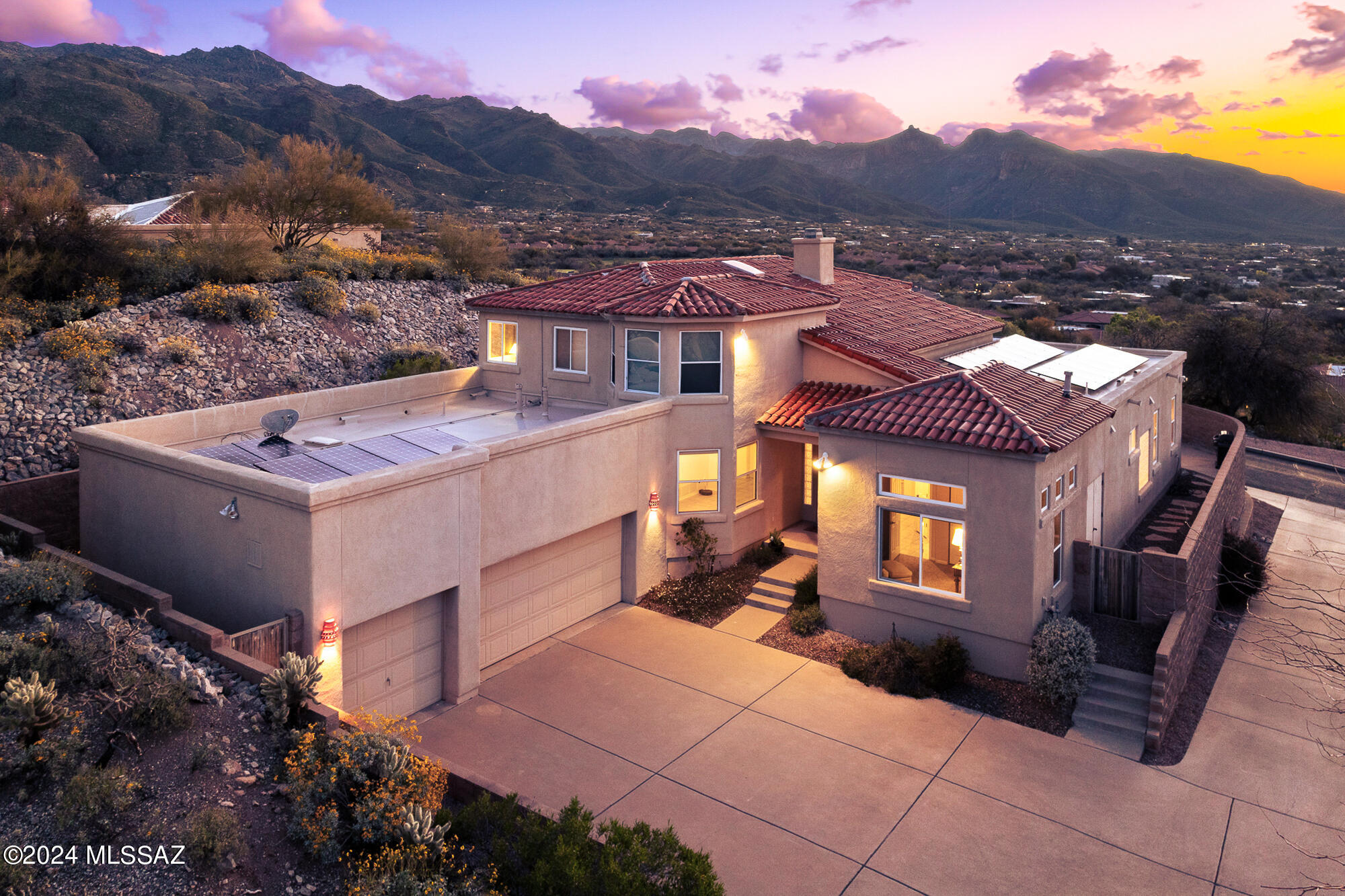 Center of the Foothills gated 5 bedroom, 4 bathroom, 3,463 Sq Ft home strategically placed on an elevated lot overlooking the Catalina Mountains and vast desert valley. Private neighborhood with only 30 homes, the Ventanas del Oeste neighborhood is close to shopping, restaurants, Sabino Canyon, and many other desirable destinations.

Multiple bedrooms, family friendly backyard, Catalina Foothills School District, and an owned solar 6.9kW max system provide approachable living in the center of the Catalina Foothills.

Vaulted ceilings and natural light, with numerous windows and mesmerizing views of the Catalina Mountains and Ventana Canyon. Main level primary bedroom and bathroom with double vanity, separate shower, soaking tub, and walk-in closet. An additional guest bedroom & bathroom on main level and three additional bedrooms, with two guest bathrooms upstairs. Kitchen is equipped with double ovens, refrigerator and closet pantry which leads to the family room with see through gas fireplace providing a seamless flow into the living room. Laundry room with washer and dryer included and 3 car garage. Enjoy the fantastic views, entertaining space, and pool from the from the backyard.

Living in the Catalina Foothills in Tucson offers a unique blend of natural beauty, outdoor activities, and urban amenities. Here are some of the best aspects:

Scenic Views: The Catalina Foothills provide stunning panoramic views of the surrounding desert landscape, including the Catalina Mountains and the city of Tucson below. The sunsets are particularly spectacular.

Outdoor Recreation: Residents enjoy easy access to hiking, biking, and exploring the Sonoran Desert. Sabino Canyon Recreation Area and Catalina State Park offer miles of trails for outdoor enthusiasts.

Upscale Living: The Catalina Foothills is known for its upscale neighborhoods, luxury homes, and gated communities. It offers a high standard of living with amenities such as top-rated schools, fine dining, and shopping.

Cultural Attractions: Tucson is a culturally rich city, with attractions such as the Arizona-Sonora Desert Museum, the University of Arizona's campus, and the Tucson Botanical Gardens. The Catalina Foothills is just a short drive away from these cultural gems.

Proximity to Urban Amenities: While the Catalina Foothills offer a serene retreat from the city, residents are still close to all the amenities of Tucson, including restaurants, entertainment venues, and medical facilities.

Sense of Community: The Catalina Foothills has a strong sense of community, with residents who take pride in their neighborhood and often participate in local events and activities.

Overall, the Catalina Foothills in Tucson offers a balanced lifestyle with access to both natural beauty and urban conveniences, making it a desirable place to live.