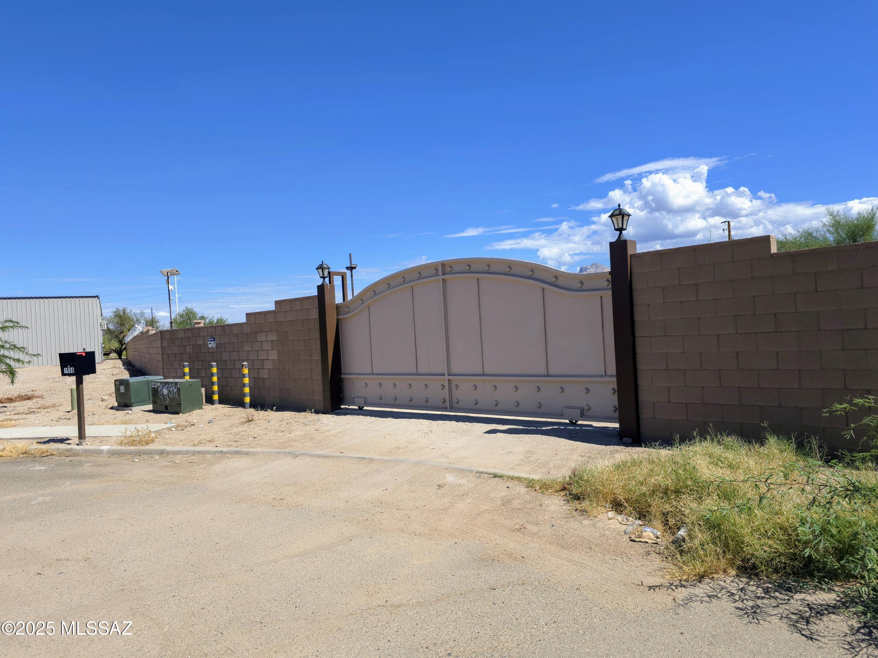 SECURE FACILTY READY TODAY! MU zoned. Currently used as a contractor's yard for a stucco & lathe company. Three (3) shipping containers are included along with building plans and permits for a 4800 sq. ft. office building.  400 amp electric service onsite. Buyer will need to connect to water and sewer if needed. NO ''FOR SALE'' SIGN ON PROPERTY.