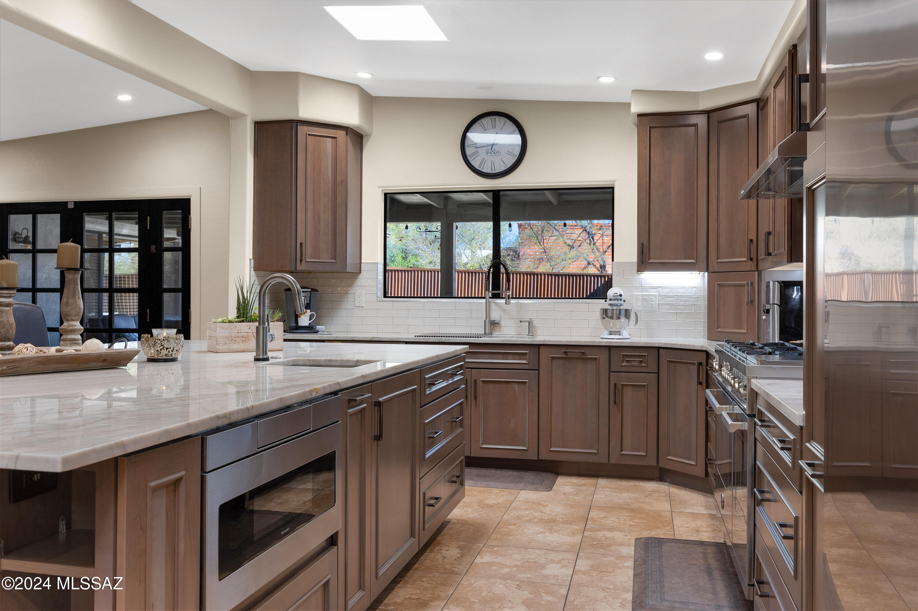 Outstanding Bear Canyon property with gorgeous remodeled kitchen, a spacious remodeled and updated guest house and pool; a combination which is rarely found. Wide Open concept main house with Stunning Chef's kitchen, recently gutted and remodeled includes Sub-Zero fridge and Sub-Zero freezer side by side and Bertazzoni Range! Owner/Chef designed an Island large enough for the big crowds on game day. The Range is a rare find and one of the focal points of this home. Open split floor plan on main house designed for an active lifestyle and entertaining. Backyard hosts large pool with full kitchen, covered patio area and gas FP. 3-4 Bed and 1-2 den on main house, gated front courtyard for outdoor dining. GH has 2 bed-2 bath and newly remodeled kitchen, S/S appliances and private front yard.