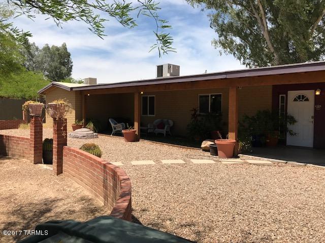 Great 5 bedroom, 2 bath home in convenient central location. Located 2  miles from UA, 2 blocks from designated bike path to UA. Features large updated kitchen, separate dining room and living room.  Includes on property parking with secure gates.