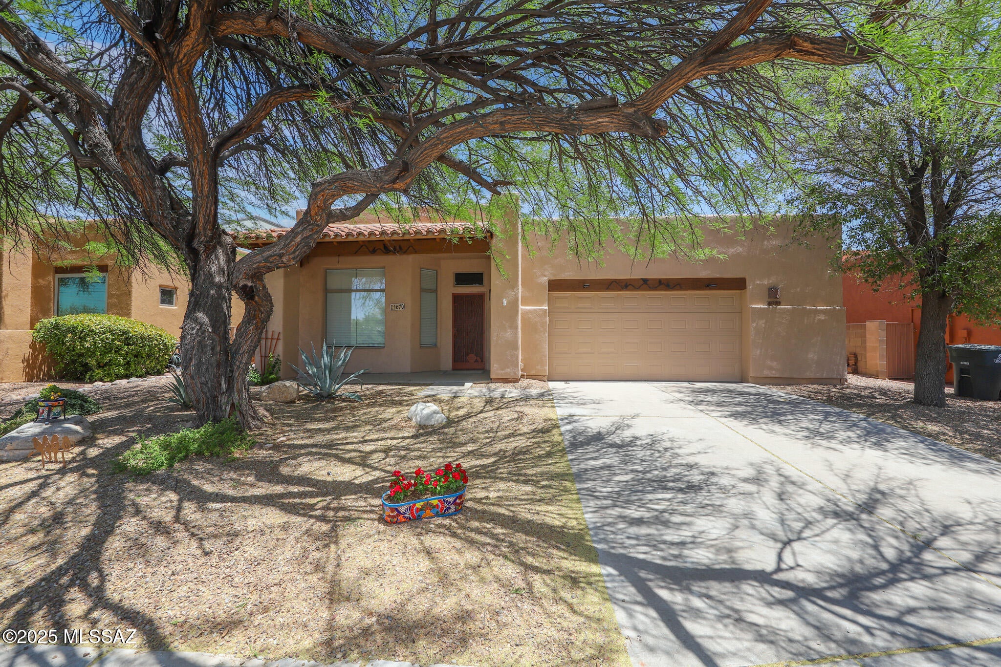 Don't miss this beautifully upgraded home offering; a chef's delight kitchen w/ S.S. appliances inc;  gas range, insta-hot faucet, granite counters, tile b.splash, & cabs w/ slide-outs. The baths have custom tile shower surrounds. Primary offers a huge walk-in closet & slider to rear yd. Other bedrooms have built-in closet organizers.  Relax under the extended, tiled, and covered patio overlooking the lush landscape.  Garage has interior storage closet. Convenient to Desert Christian & Bloom schools