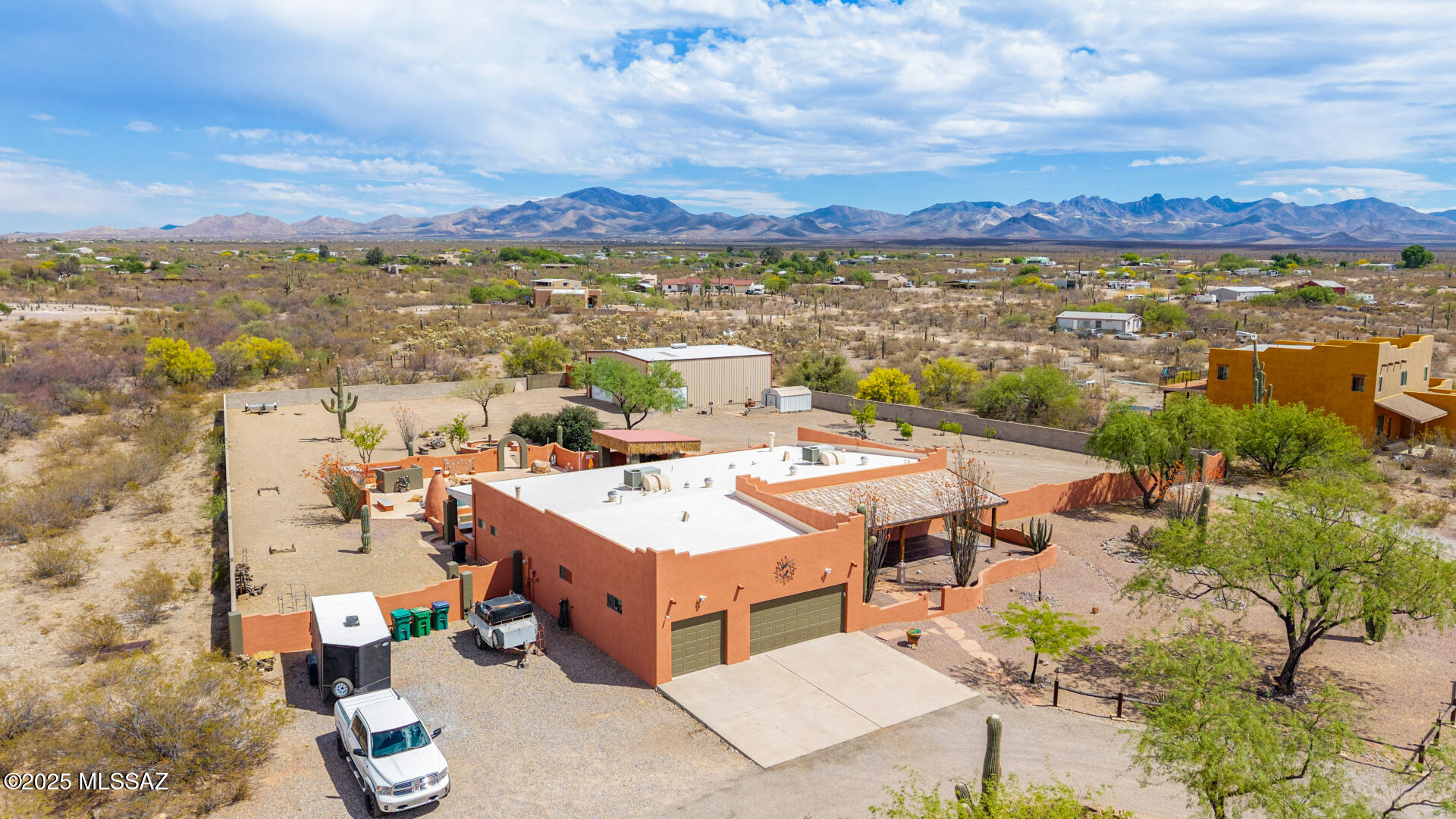 Set on an old Homestead from the 1800's, this property is Arizona Ranch-style living at its best! Come visit this beautiful, expansive 4 acre + custom-built horse property that is perfect for someone with an RV, a boat, lots of cars, trucks & other toys. Your family will love to make memories in this stunning home which features: upgraded Integra block construction system offering superior thermal performance ( low energy bills), 4 + acres, nearly 1 acre entirely fenced in, a 15,000 gallon PebbleTech pool, 6 car garage, no HOA, Highly Desirable Vail School District, & a giant Workshop w/ 14ft entry doors! The workshop dimensions are 50 x 40 x 16 & has full RV hook ups in 2 locations on property. The outdoor entertainment features of this home are unmatched including a Sonos speaker system inside & out, PebbleTech pool, handicap accessible walkway, 9 fruit trees (grapefruit, orange, lemon & lime) & access to a wash that leads to over 2 miles of private horse trails that wind throughout the area. The main house features 4 bedrooms, 3 baths, open floor plan & a gourmet kitchen w/ granite countertops & stainless steel appliances. Come make this amazing property your home!