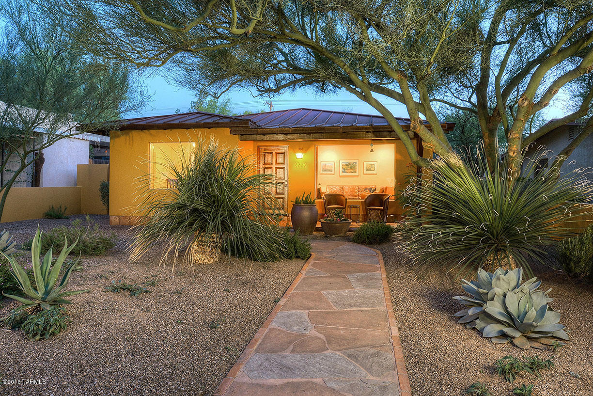 Absolutely perfect Sam Hughes bungalow, updated and meticulously cared for, you can tell this one is special right when you step up to the front covered porch entry-beautiful indoor and outdoor living spaces, built-in's, custom paints, Mexican tile finishes and the 3rd bedroom also serves as an attached guest quarters with private bath that can be accessed from the main house or via an outside private entrance. The incredible back yard was all professionally designed and crafted with the highest quality materials, and includes an outdoor dining room, hidden parking for two cars through an electric gate, storage that is actually gorgeous, and so much more. All new plumbing, all new gas, new electric to the house and tons of upgraded outlets inside. Wonderful!