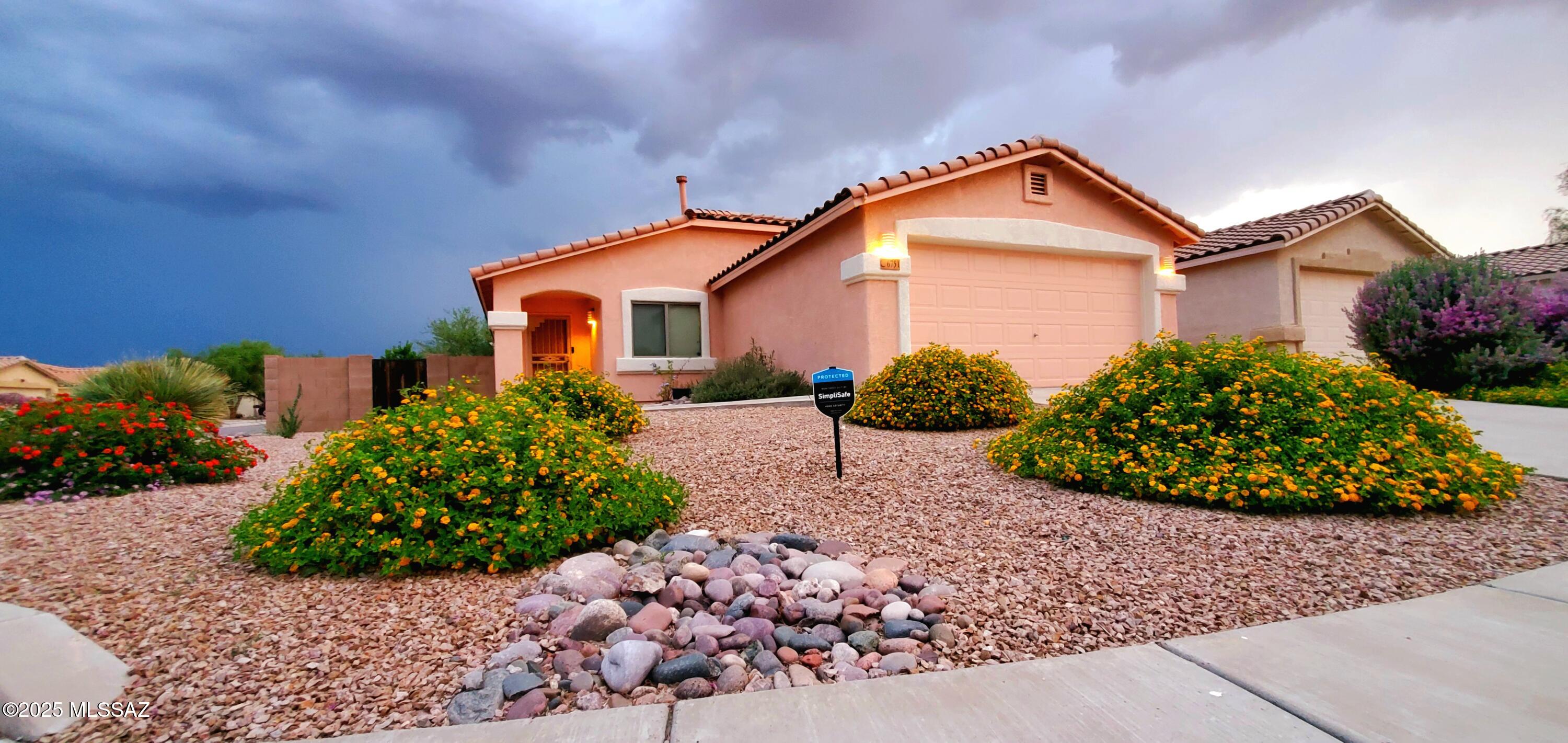 Beautifully maintained home on corner lot. Move in ready with many upgrades. Interior features include recently remodeled kitchen, top of the line stainless steel appliances, wood cabinets with soft close features, quartz countertops, upgraded light fixtures. Laundry room with cabinets washer/dryer to stay. Smart features throughout  home including lighting, garage door, alarm, insta-hot water for bathrooms to name a few. HVAC and water heater 2 yrs old. Energy efficient (see documents). Finished garage - shelving, racks for bikes and fishing rods. Back yard covered patio has finished slab and rolling shades to enhance your viewing of mature landscaping which includes rose bushes, lemon grass, unique trees, garden area with separate irrigation and much more Shown by appointment only!