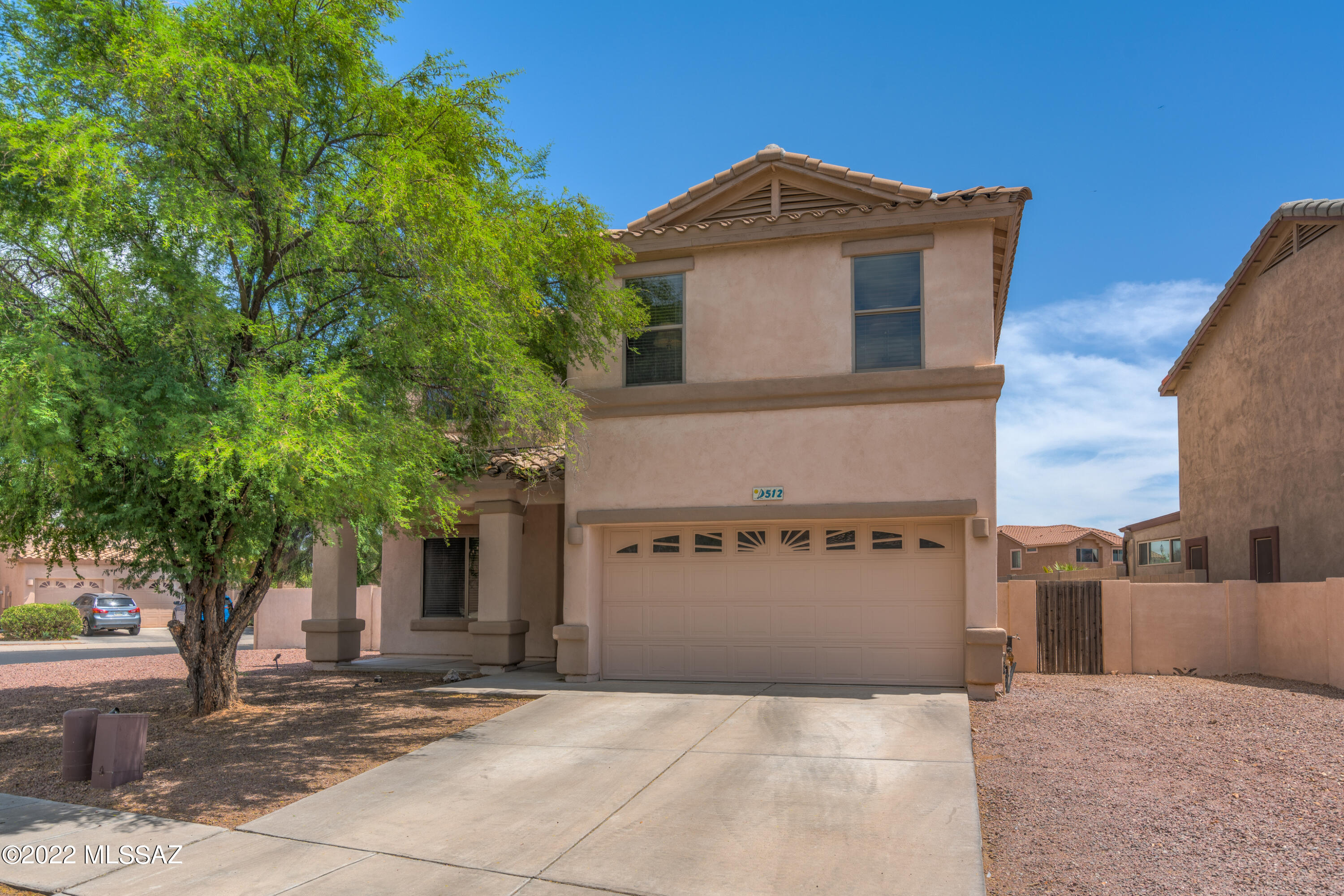 This beautiful huge corner 2-Story home in a gated community of Rancho Sahuarita is a must see! The 4 bedroom 2.5 bath contemporary home comes with magnificent Stainless Steel appliances,  AC installed 6/2020, plenty of storage, cozy gas fireplace in the living room, and space for all your family and friends to enjoy. Cook on the built-in BBQ or sit around the outdoor fireplace in the private low maintenance backyard with private access to lake.