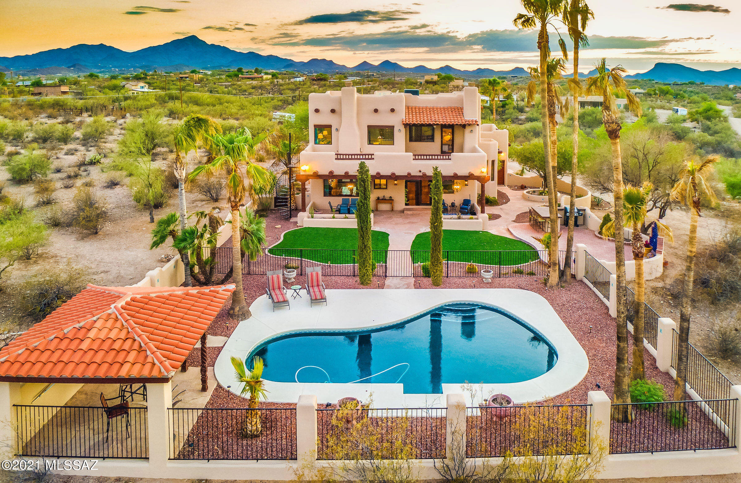 An Entertainer's Dream! Private resort style Hacienda located on 5.58 acres with unobstructed mountain, sunset, sunrise and city views on Tucson's west side, features the BEST Indoor/Outdoor living imaginable! ''Old World Charm'' meets New World Amenities include Viga beam ceilings, saltillo floors, hand painted cove ceiling in Dining Room, ornate lighting, custom kitchen cabinetry, talavera tile, Viking building in double oven and gas cooktop, new vinyl flooring on second level and SO MUCH MORE! Gorgeous pool, outdoor kitchen with bar seating, ramada with wood beam ceiling, courtyard with beehive fireplace and fountain, multiple viewing decks, freshly painted exterior. Approximately $100K in upgrades in the last 18 months! NO POLY PIPES! NEW WINDOWS and so much more!