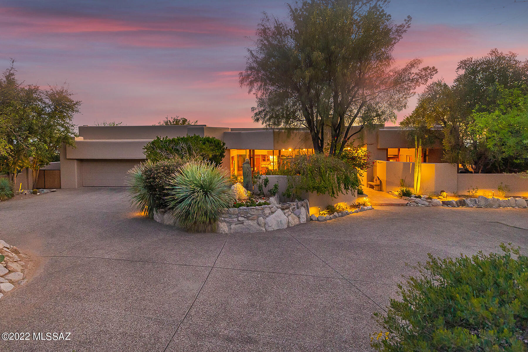 David Tyson designed desert contemporary home located in the prestigious Cobblestone Estates. A luxury guard gated private community high in the Catalina Foothills. Unique and well-designed architectural lines throughout the home. Easy flowing spit bedroom plan, light and bright 3973 sq. ft. home on 1.3 acres. Spectacular cul-de-sac elevated lot offering dramatic Santa Catalina Views and Tucson city lights. 3 bedrooms plus en-suite multi purpose room which could also act as 4th bedroom, 4 baths, great room style  kitchen, dining area and living area with spectacular views and doors opening from every room to access outdoor patios and views. Beautiful park-like outdoor living space with desert vegetation, fruit trees, charming sitting and walking areas, two gazebos, all updated LED landscape lighting. Pool, spa and spacious 3 car garage!