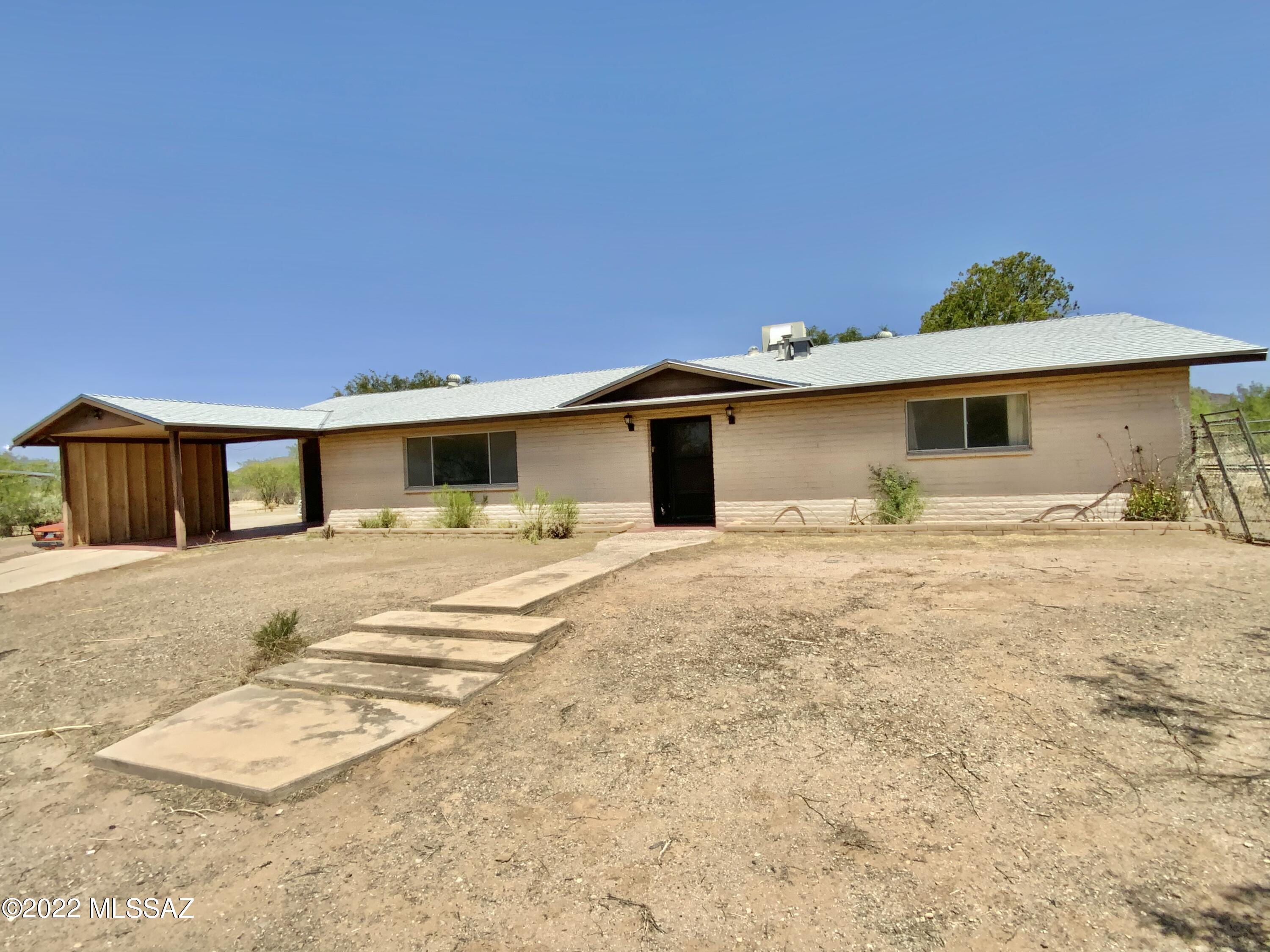 Total fix up/gut! 2096 ft.² Slump block home. 3bed-2bath w/ AZ room. Detached 3 car garage w/ shop area 1758 ft.². All on 3.64 acres horse property w/ private registered water well & views for days. GR-1 zoning allows 1 dwelling per acre. Sewer options off of Irvington.
