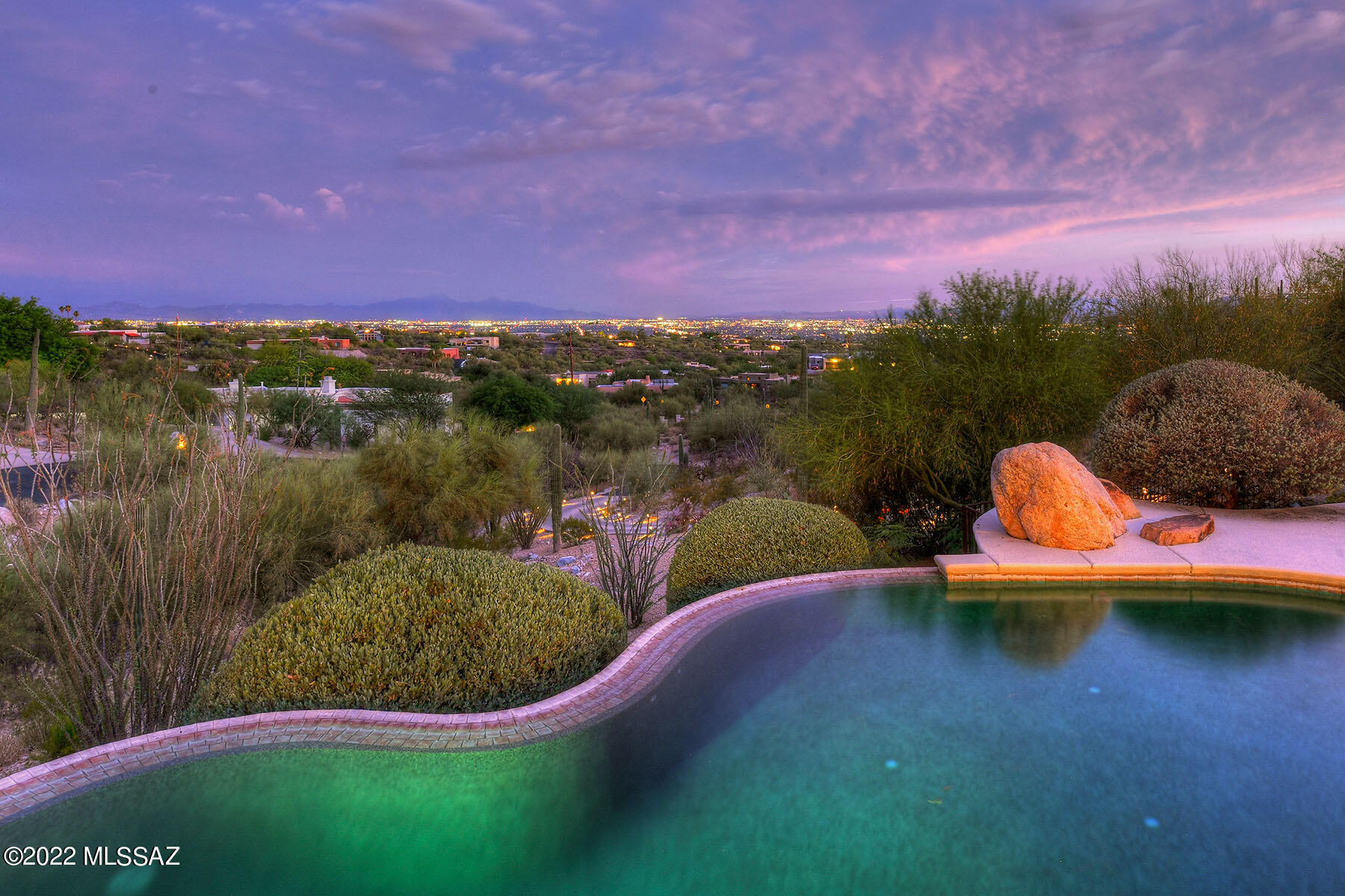 Stunning Panorama of City Lights! Home Resort. Expanses of Glass & French Doors Bring Views Inside. 80' Stone Tiled Covered Patio w/ Gas Grill, FP, Fans & Heat Lights to Sparkling Pool & Spa's Mtn/City Views. Chef's Kitchen: Gorgeous Slab Granite, Walk-in Pantry. 2018: Custom Cabinetry, 48'' Sub-Zero Fridge, Island w/ Wolf 6-Burner Gas Cooktop, 2 Wolf 30'' Convection Wall Ovens. New Roof 2018; 2019 Owned Solar:12-month Avg Electric $148/month! Liv Rm to Cool N Covered Patio & yard w/ lemon, orange, kumquat trees. Romantic Master: Retreat Area, large Walk-in Closet + adjacent wall of Built-ins, Walk-in Shower w/ Body Spray, Garden Tub, Granite Vanity. Exercise Rm. Bay Breakfast Area + Formal DR. Fam Rm features handsome gas FP, opens to porch. Wine Rm, 4 Full Baths. 2'x2' Travertine Floors