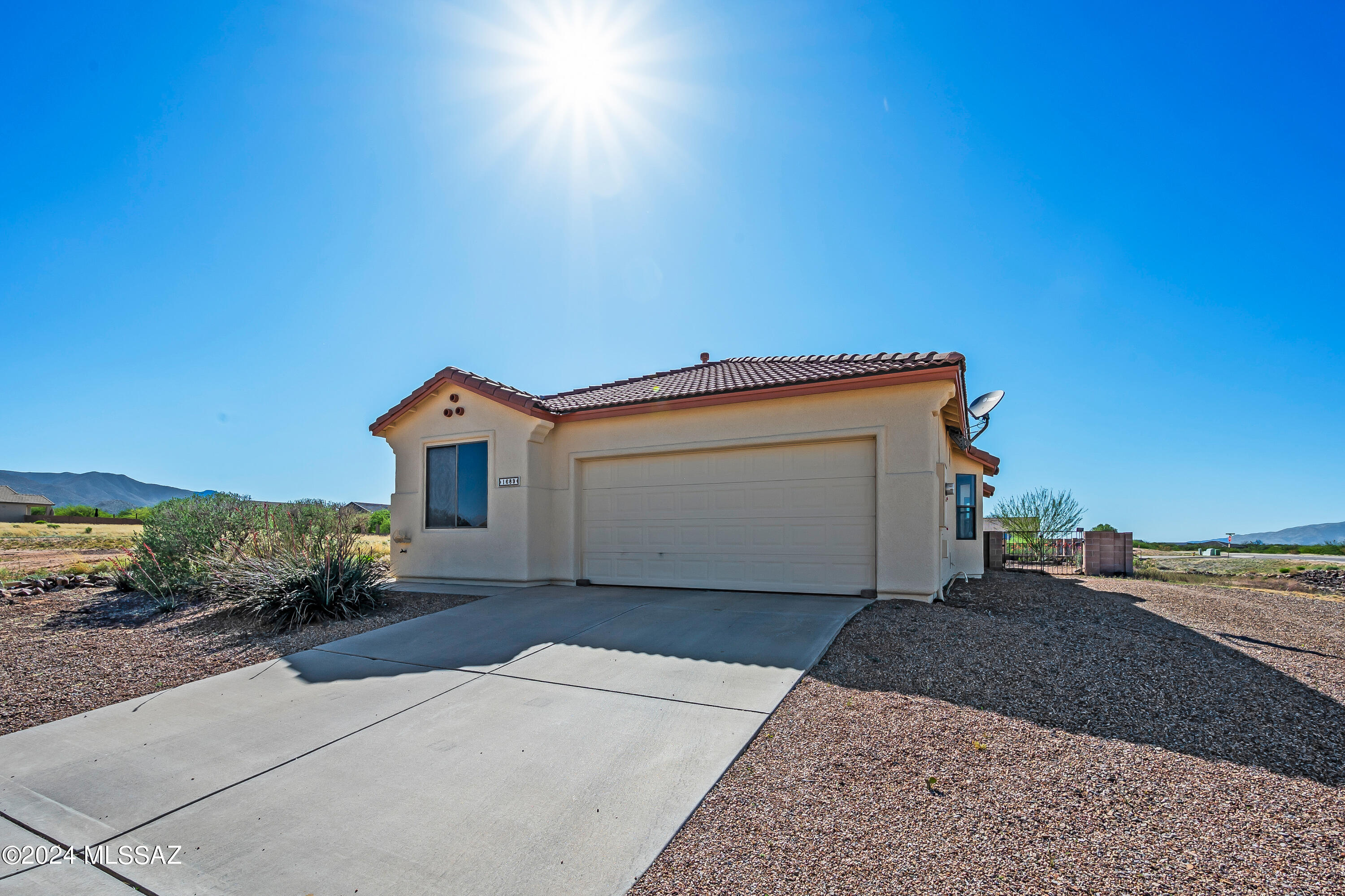 Range price: Seller to consider offers $290,000-$300,000 VIEWS!!! Welcoming open floor plan home is a 3 bedroom split plan with a den. Granite countertops, Stainless appliances, 18'' ceramic tile and cozy gas or log fireplace. Amazing Mountain Views!! Property borders open area allowing great views of multiple mountain ranges from two patios.  Sunrise and sunsets from this home will not disappoint!  Wonderful location for commuting to Sierra Vista, Tucson or surrounding areas.