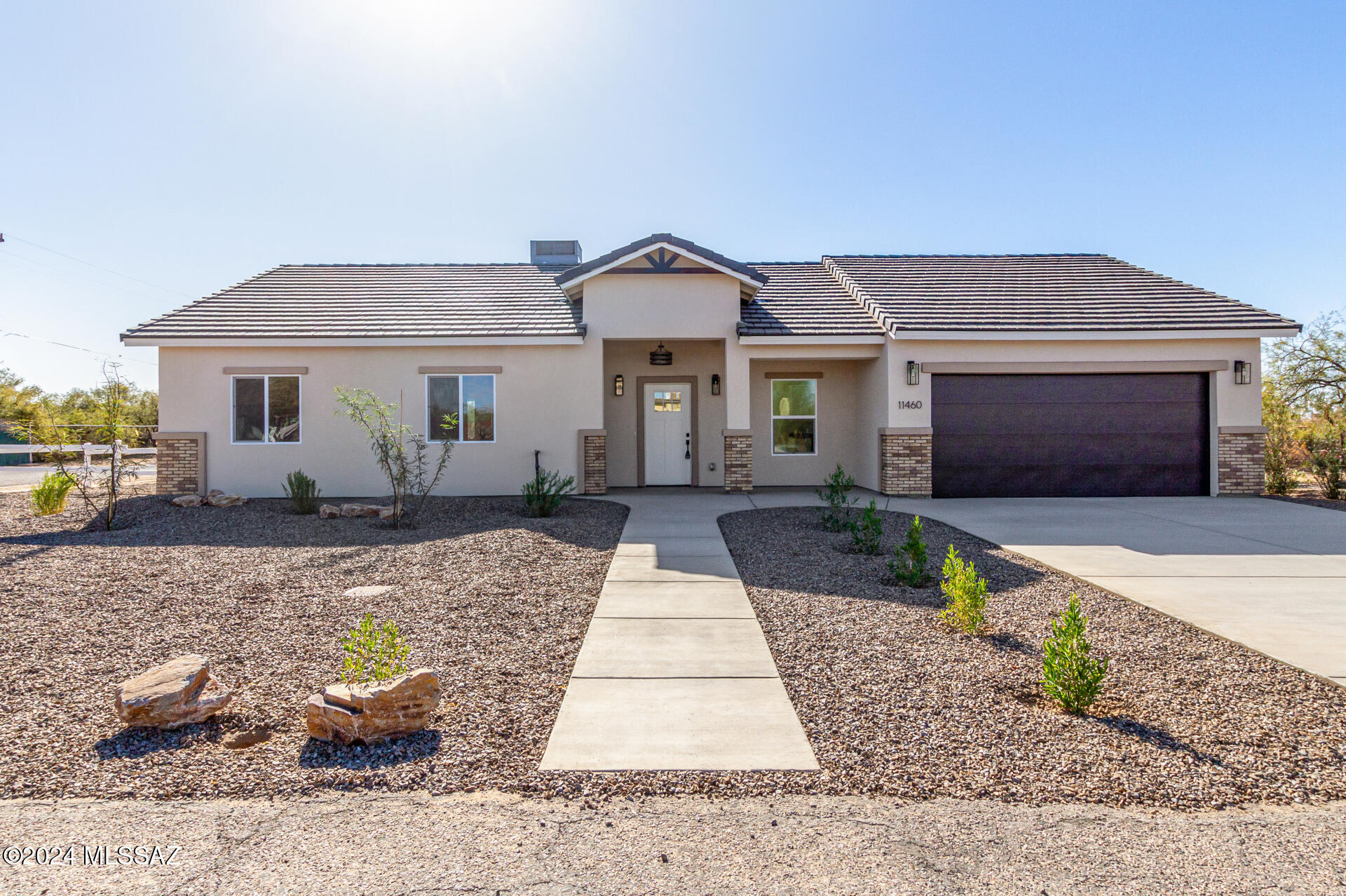 PRICED TO SELL!!!Welcome to your dream home at 11460 W Amole Circle! This custom-built ranch style home features 3 bedrooms, 2 bathrooms, and a spacious open floor plan perfect for entertaining. With high ceilings, tile flooring, and modern fixtures throughout, this new construction property is a true gem. Enjoy beautiful views from the large corner lot, while the double paned windows and tile roof provide energy efficiency. The kitchen boasts granite counters and energy star appliances, 42'' tall upper elegant cabinets while the bathrooms feature dual vanities. Conveniently located, NO HOA, near highways, this home also includes a 2 car oversized garage and professionally landscaped yard, concrete driveway. Don't miss out on this stylish and sophisticated property!