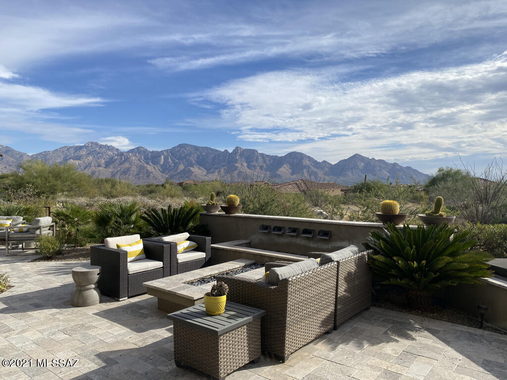 Gorgeous contemporary home with expansive mountain views. Beautiful flooring throughout (no carpet) and upgrades galore! Fabulous open kitchen with a massive island, warming drawer, ice maker- perfect for socializing with friends and family. Enjoy the professionally designed landscaping with travertine pavers, custom fire pit, waterfall, built-in barbecue. Enjoy country club living at its finest at beautiful Stone Canyon: world-class golf, tennis, pickleball, pool and spa, fitness facility, a beautiful new clubhouse, and fine dining! Call agent for a personal tour.