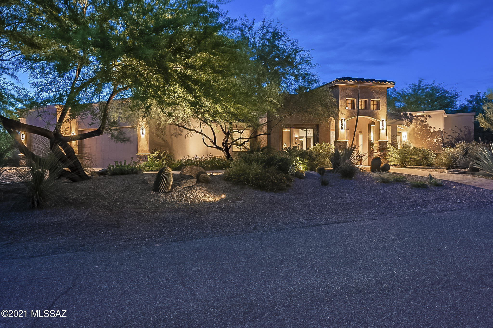 Wows upon arrival! From the moment you walk up to the grand custom glass entrance, this home pleases at every turn. Concrete floors to soaring ceilings, this splendid 3278 SQFT, 4BD, 3.5BA beckons you to enjoy its beautifully appointed kitchen w/ commercial grade range & custom vent hood, walk-in pantry, stunning master suite w/ cozy fireplace, open concept living, generous bedrooms in split floorplan. Features like double fridge/freezer, bar w/ beverage fridge, custom light fixtures, custom-built closets, soaker tub & 3 car garage add to this already impressive home. Yet it nearly pales in comparison to the exquisite resort-style living that awaits in the backyard where you can enjoy the expansive covered patio, built-in grill, spa, pool & mountain views on 0.57 acre N/S facing lot.