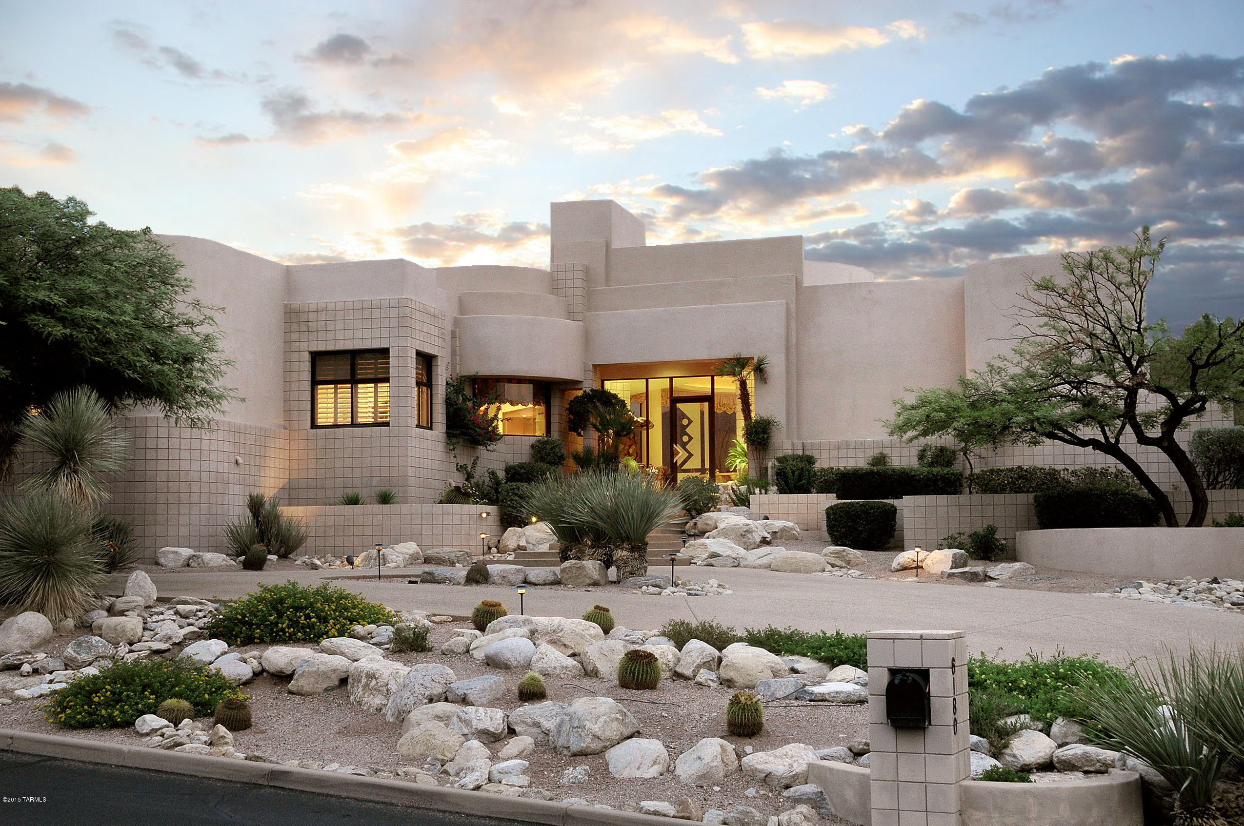 Stunning architecturally designed contemporary w/ magnificent mountain & golf course views in prestigious gated Ventana Canyon Country Club. Exquisite entry with water feature, elegant Living Room and Dining Room with dramatic floor to ceiling windows,gourmet island kitchen with granite countertops, top of the line stainless steel appliances, Wolf gas stove top, lovely breakfast area open to family room with fireplace, gorgeous travertine floors, 4 bedrooms plus study (or 5 bedrooms) with 5186 sq.ft., master suite w/sitting area, fireplace, luxurious bath w/Jacuzzi tub, large walk- in closet. Sensational backyard with covered patios, pool,spa, fireplace,lush landscaping, majestic mountain views, 3 car garage, circular driveway & Dist. 16 schools.Floor plan under photo, then virtual tour.