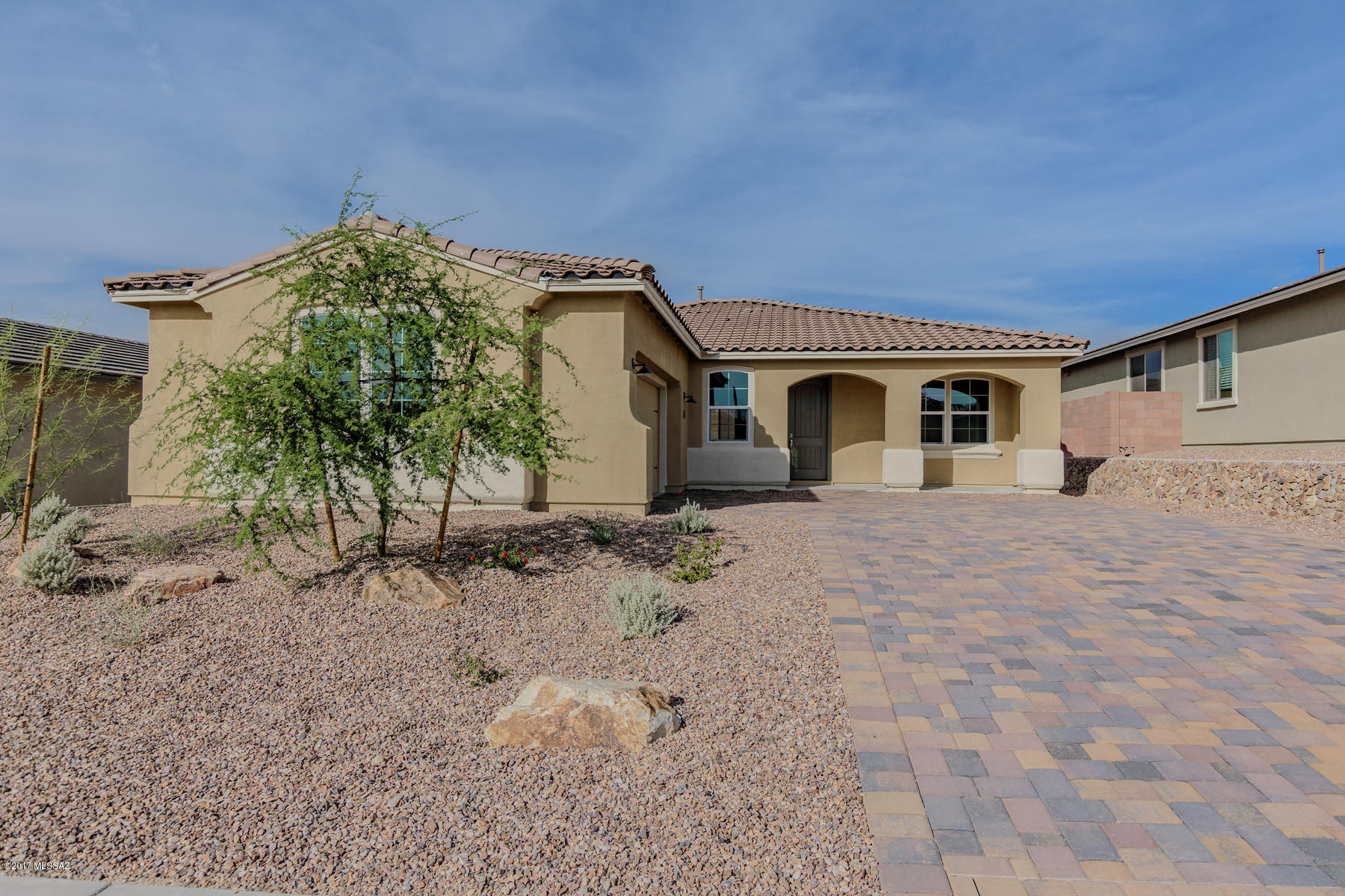 Move-in READY!!. Beautiful Lookout plan features a Spanish style exterior with pavered front porch. Spacious eat-in gourmet kitchen w staggered cabinets, LED under-cab lighting, granite countertops, tiled backsplash, oven/micro combo & 5-burner cooktop & walk-in pantry. Spacious island/breakfast bar is a natural family gathering location. Master retreat boasts 2 large walk-in closets, granite vanities & tiled walk-in shower/w spa niche. Other upgrades include: pendant light pre-wire, recessed lighting, two-tone paint, 8ft doors, gas BBQ stub and more!