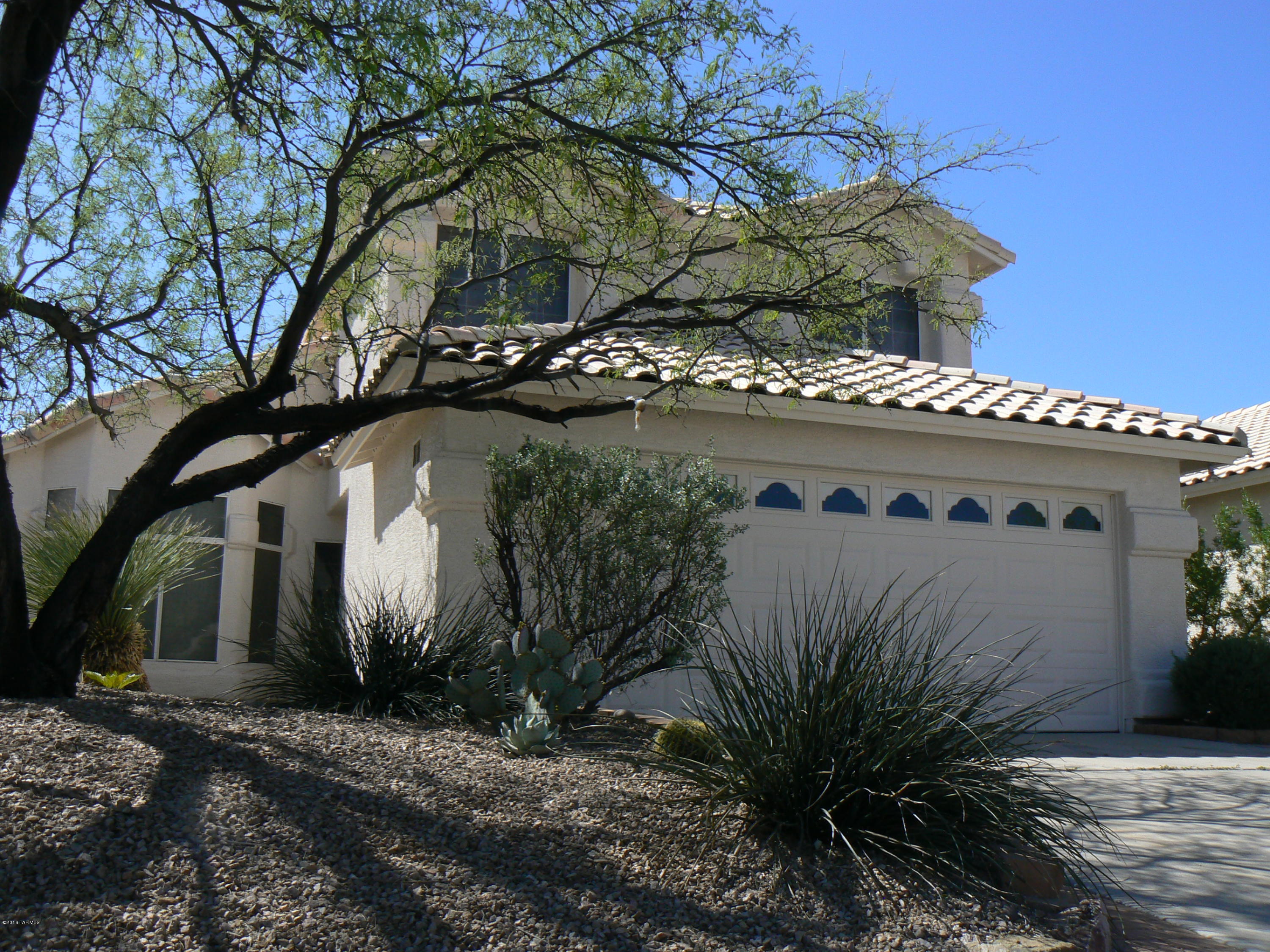 Beautiful 4 bedroom home minutes from Sabino Canyon. Vaulted ceilings, new carpet, paint, and light fixtures make this a quality, move in ready home. Plantation shutters outline a large bay window that frames mountain views from the Living/Dining Room.  Open concept living is exemplified by spacious eat-in Kitchen and Family Room bathed in natural light. Mature foliage shade both the front and backyards, the secluded secret garden includes a fish pond and trellised patio for year round enjoyment. This is a must see!