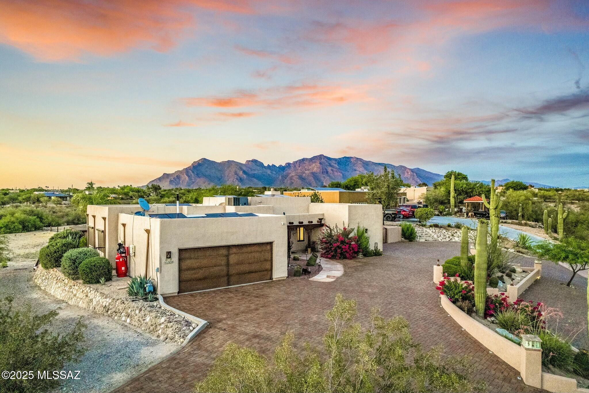 Discover your own piece of Tucson excellence with this stunning desert home. The interior features a striking exposed wood beam ceiling and architectural details that creates a warm, spacious atmosphere and adds natural character. This fully updated home is turn-key and features a resort style backyard complete with a beautiful pool, spa, multi-level deck, outdoor bathroom, and covered gazebo. A sprawling acre-plus of Sonoran Desert horse property, complete with essential animal facilities and ample space for an arena (with room for future expansion). Last but not least, the stunning backdrop to this amazing home is the Catalina Mountains, a dominant highlight of the Tucson landscape. This is more than a home; it's a lifestyle opportunity that is few and far between.