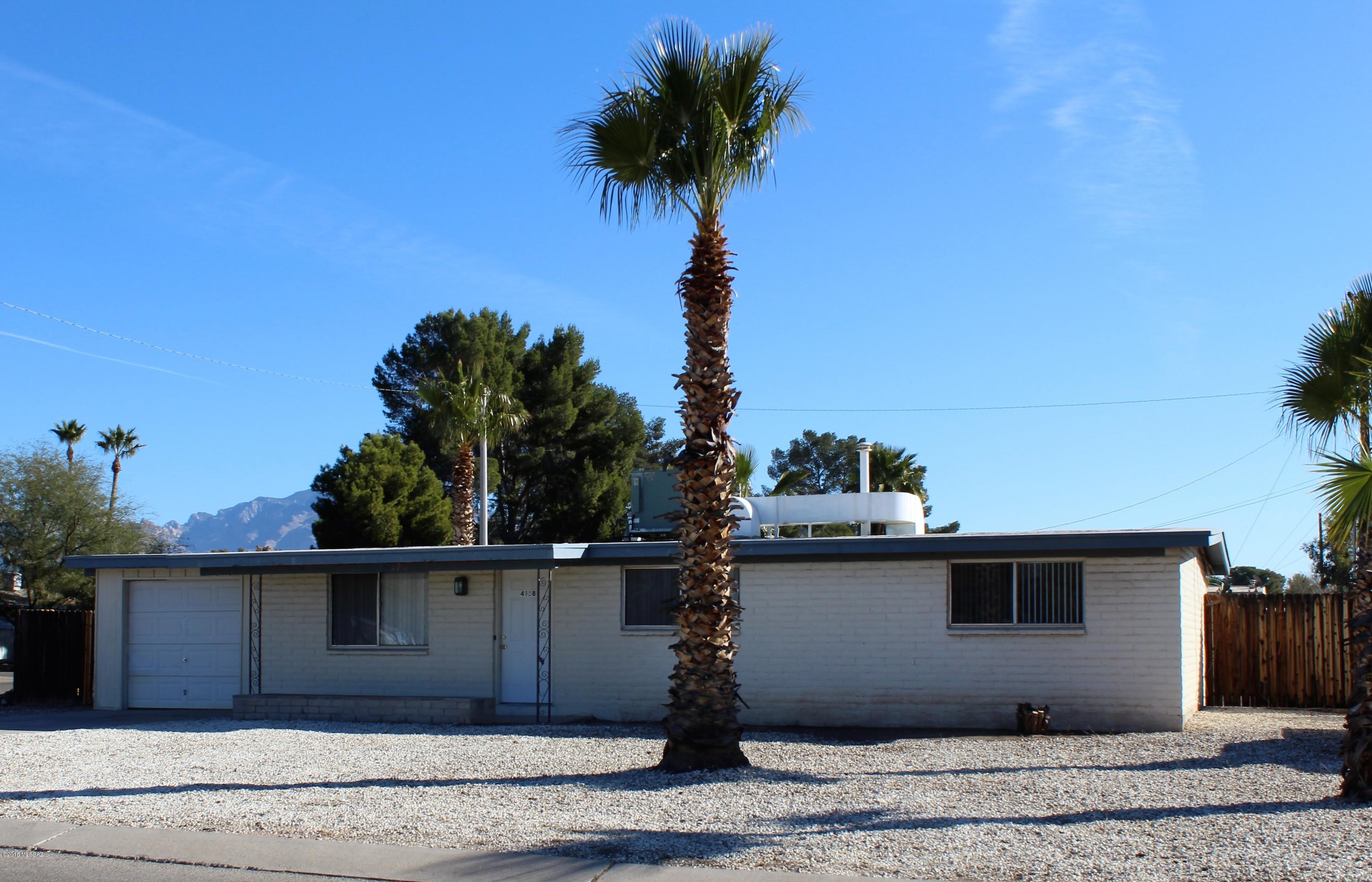 Great 3 bedroom, 1.75 bath home with new carpet and updated kitchen sits on a huge corner lot with 2 double gate entries. Kitchen has electric stove, dishwasher and fridge. Single car enclosed carport with laundry room.