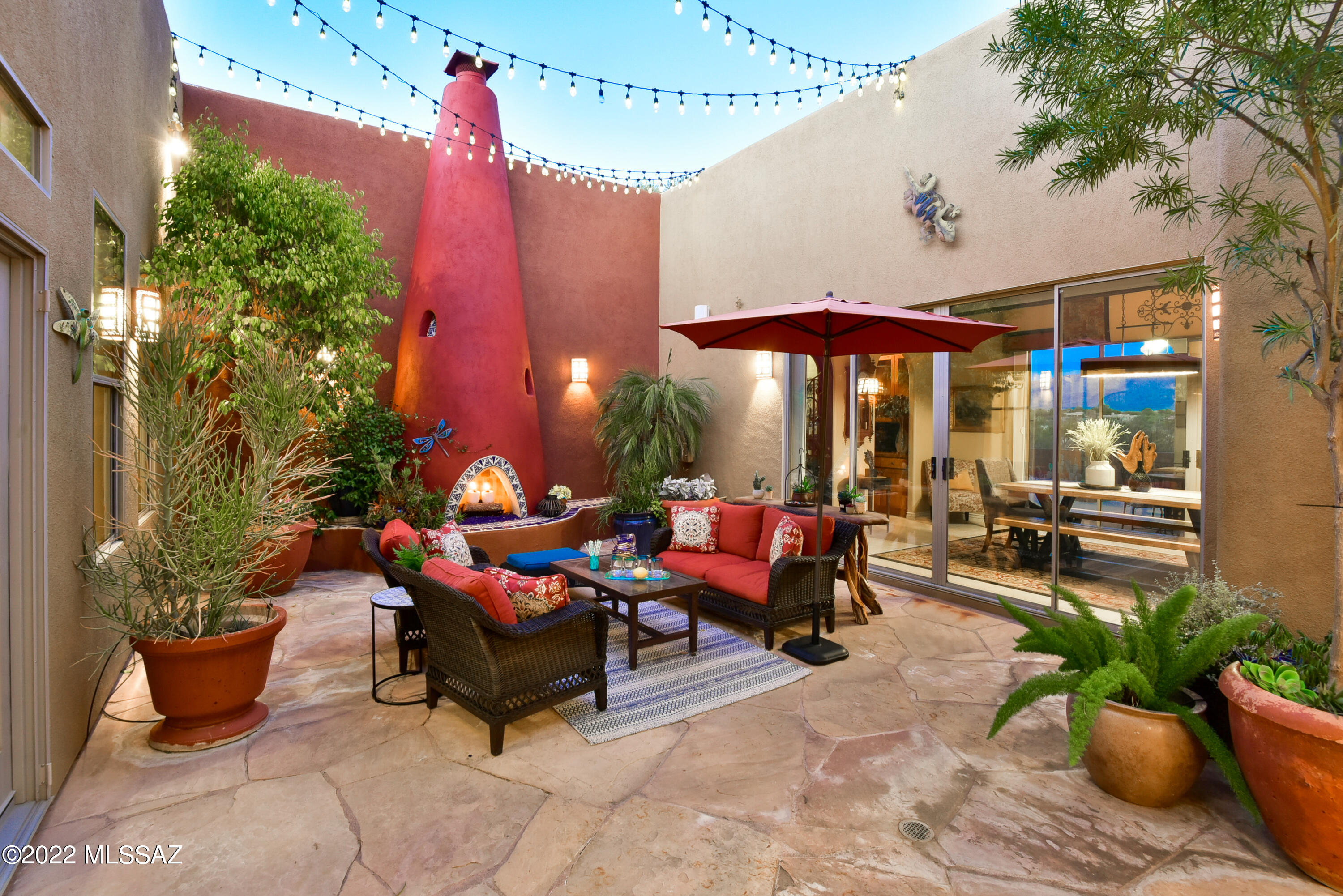 Absolutely phenomenal property with fabulous Catalina Mountain views! Upon arrival via a circular paver driveway and inviting front courtyard, you will experience a sense of relaxed tranquility. Accessed on 3 sides via glass doors, you'll fall in love with the charming central atrium with kiva fireplace. The spacious and stunning great room with stone faced fireplace, wall of windows, dining nook and luxury kitchen (2 Sub-Zero refs, separate Frzr, 2 dishwashers, Viking & GE appls, 2 pantries & 2 islands) is open and bright. Main house with split layout (den/office, guest suite, powder rm, ldry & huge primary suite) is augmented by full casita accessed off courtyard. Entertainment-oriented yard with pool, spa, pool bath, firepit, BBQ & pizza oven!  Many updated features (see Documents).