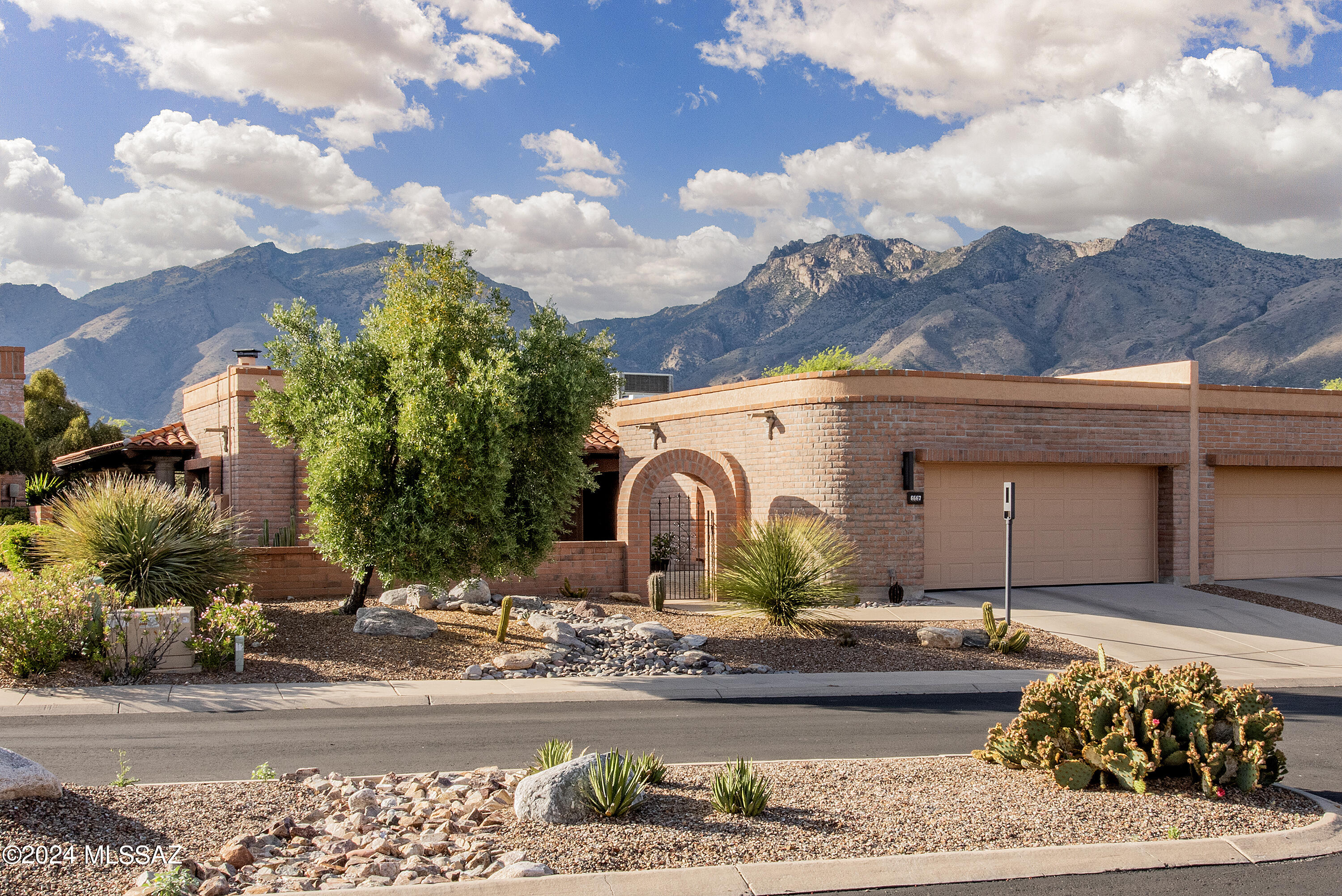 Exceptional REMODELED Fairfield that will absolutely knock your socks off! Prime lot w/ completely UNOBSTRUCTED, MAJESTIC MOUNTAIN VIEWS! Enter private, charming courtyard into a SPECTACULARLY UPDATED DREAM HOME. Great Room w/ high ceilings, new Pella sliders & luxurious tiled corner fireplace. Thoughtfully remodeled, ''fully loaded'' chef's kitchen w/ amazing quality cabinets, leather marble counters & Wolf induction cooktop. Den/family rm off kitchen w/ lovely built-ins! Outstanding primary suite w/ GORGEOUS bathroom, large walk-in closet & VIEWS GALORE! Guest room w/ Murphy bed/shelving. FANCY, pristine garage w/ epoxy floors. With AMAZING wrap around, deep patios & GLORIOUS outdoor space, this home SHINES BRIGHT! Quiet cul-de-sac close to restaurants, shopping & Sabino Canyon! Hurry!