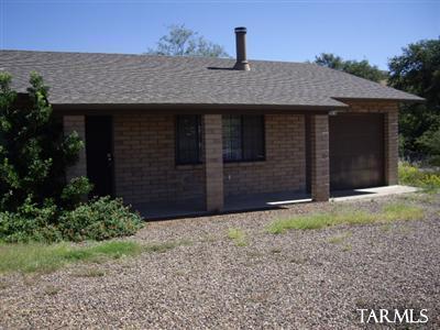 Spacious 3 bedroom home with garage, fireplace, washer , dryer, fenced yard and custom kitchen, breakfast bar indoor laundry, new carpet and covered patio.