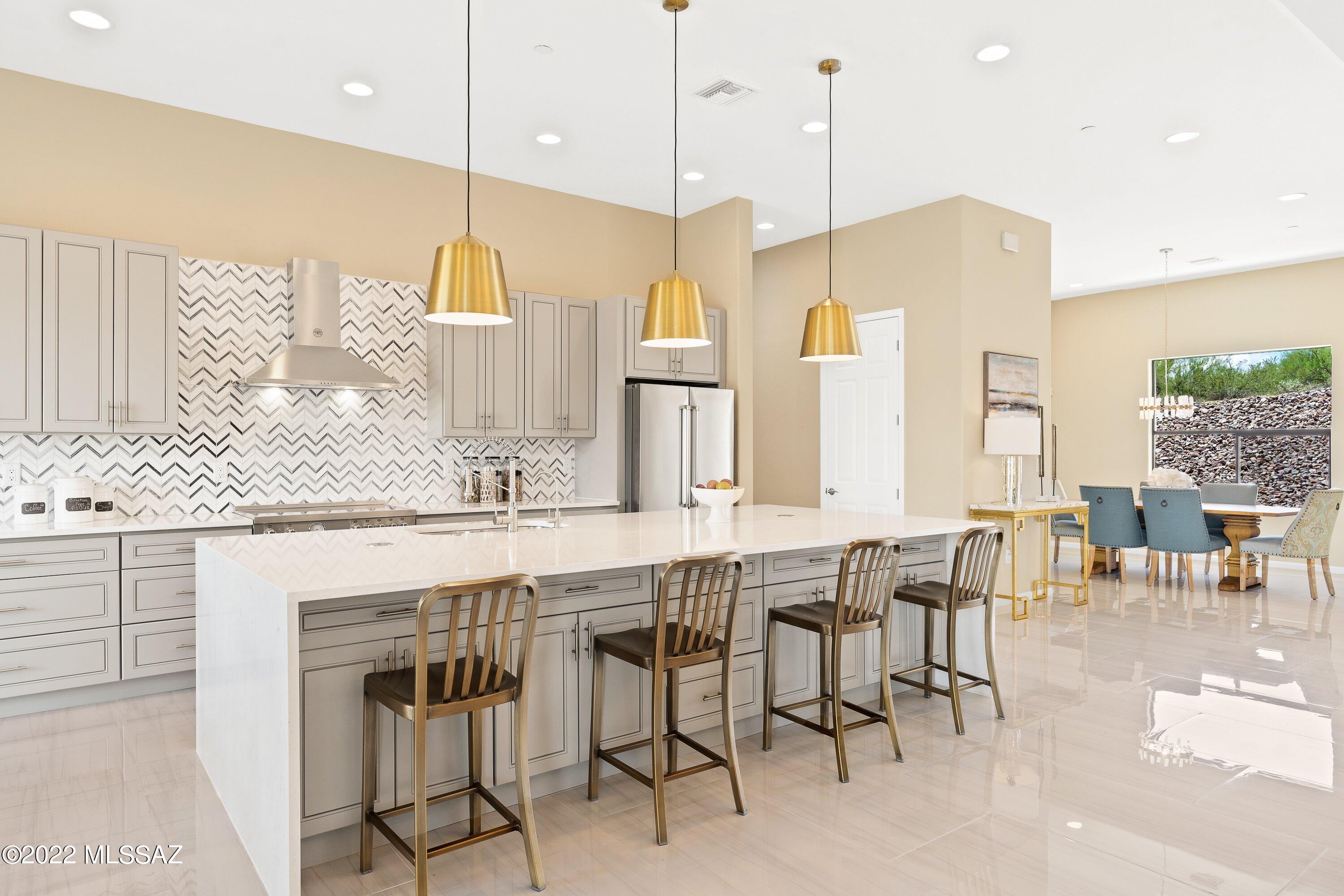 Welcome to 10175 N La Cholla Blvd, where modern elegance meets unparalleled convenience. This stunning property offers a unique opportunity to embrace luxurious living in the heart of Oro Valley. Boasting 4 bedrooms, 4 bathrooms, and 3,100 square feet of thoughtfully designed space, this single-family home is sure to impress even the most discerning buyer. Upon entering, you'll be captivated by the seamless fusion of contemporary design and timeless sophistication. The expansive living areas are bathed in natural light, creating an inviting ambiance for both relaxation and entertainment. The gourmet kitchen is a culinary masterpiece, featuring high-end appliances, sleek countertops, and ample storage space. Retreat to the luxurious master suite, where serenity awaits amidst a spacious... ..... layout, a spa-like ensuite bathroom, and private access to outdoor living spaces. Additional well-appointed bedrooms offer comfort and versatility for family members or guests. Outside, a private oasis awaits, complete with meticulously landscaped grounds, a tranquil patio, perfect for enjoying the beautiful Arizona weather year-round.

Conveniently situated near great Oro Valley schools, parks, shopping centers, dining, and entertainment options, this home offers the perfect balance of luxury and convenience. Don't miss your chance to experience the ultimate in upscale living. Schedule your showing today and make this exquisite property your new home!