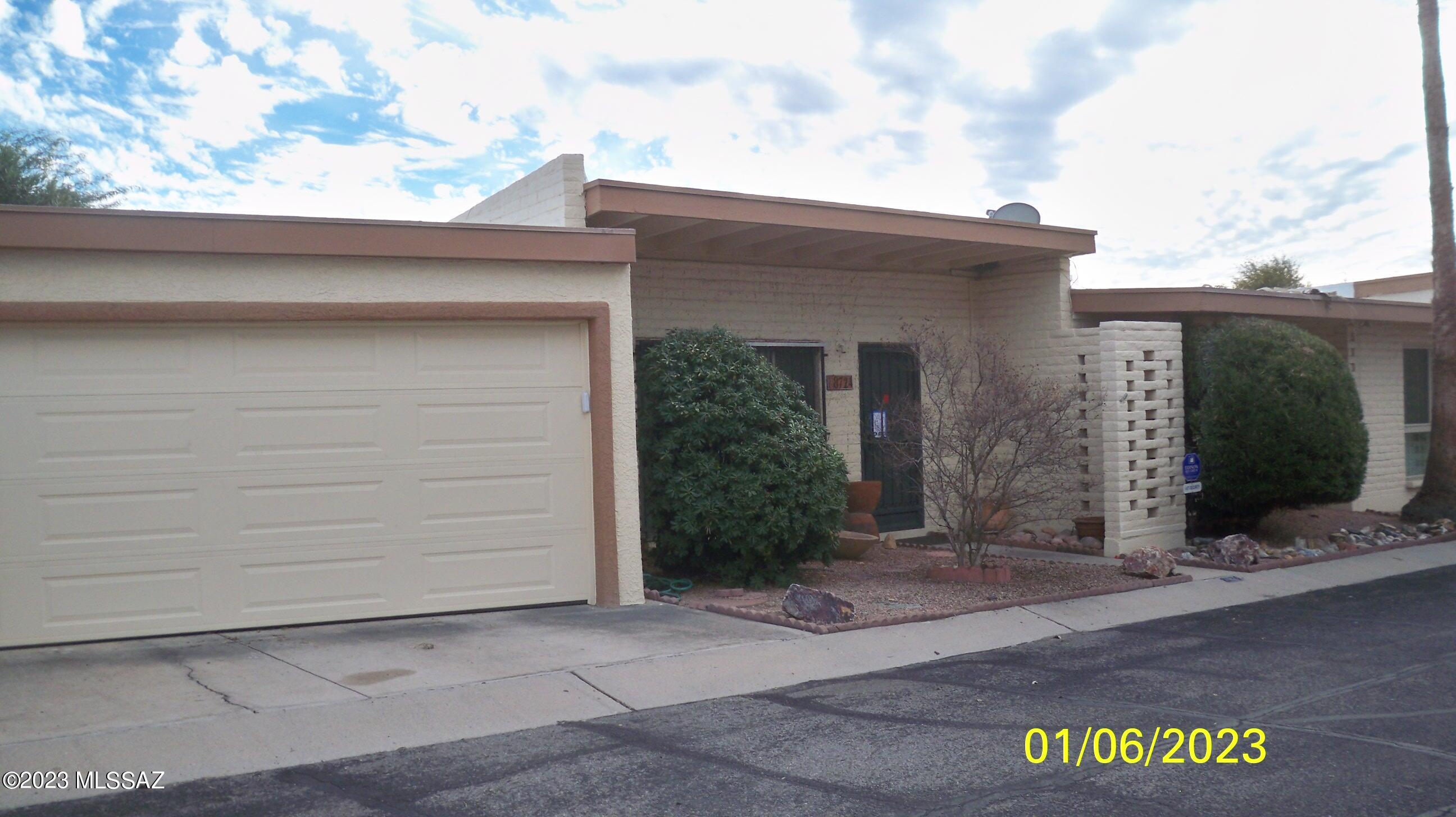 NOTE:  A THREE-DAY LOOK IS IN EFFECT FOR ALL TYPES OF BUYERS, BOTH OWNER-OCCUPANT BUYERS AND INVESTOR BUYERS.   THE SELLER WILL REVIEW OFFERS ON 1//21/23.   NO OFFERS SHOULD BE SUBMITTED BEFORE 1/21/23.  Convenient East side location to all amenities, this condo unit which feels more like a townhouse offers a 2 bedroom and two-bath floor plan with an attached two-car garage plus access to a private common area yard.   The Community Pool and Club House are only steps away from this unit.   Some upgrades and improvements are needed to bring this unit up to par and make it shine again.