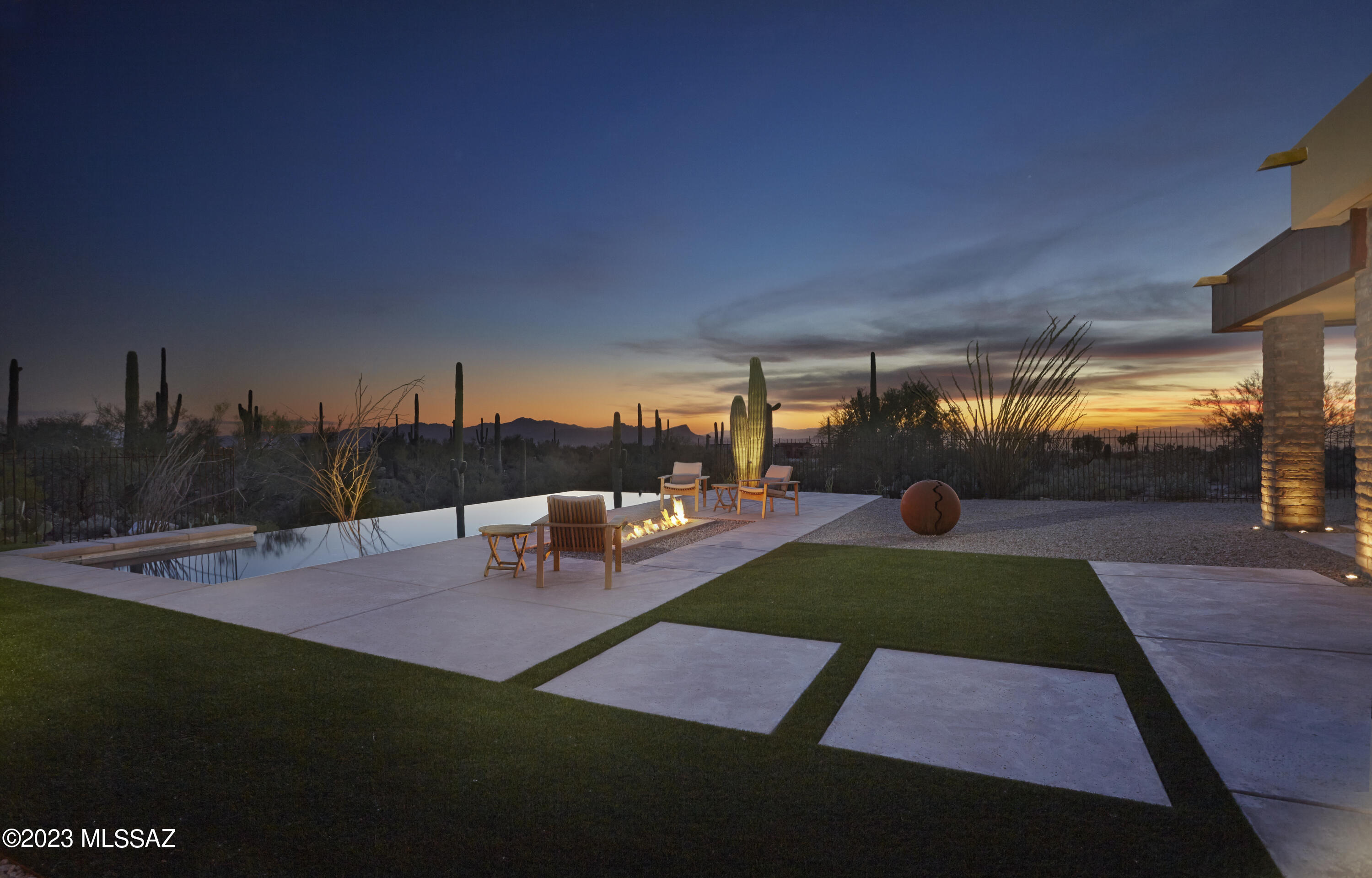 Stunning Custom Contemporary within the gates of The Ritz-Carlton Residences, Dove Mountain. Amazing attention to detail, with too many custom features to list. Enjoy the impressive main house, guest house and private home gym (or office!). Features of the home include automation system, owned solar, remote operated screens/awnings/window coverings. Disappearing window wall in great room leads out to immaculate backyard, complete with pool, spa, fire feature and meticulous landscape design. Sunrise, sunset, mountain and city views await you on this spacious and private homesite. Enjoy access to The Ritz-Carlton Resort, concierge services, home management services, social events & more. This is a MUST SEE!