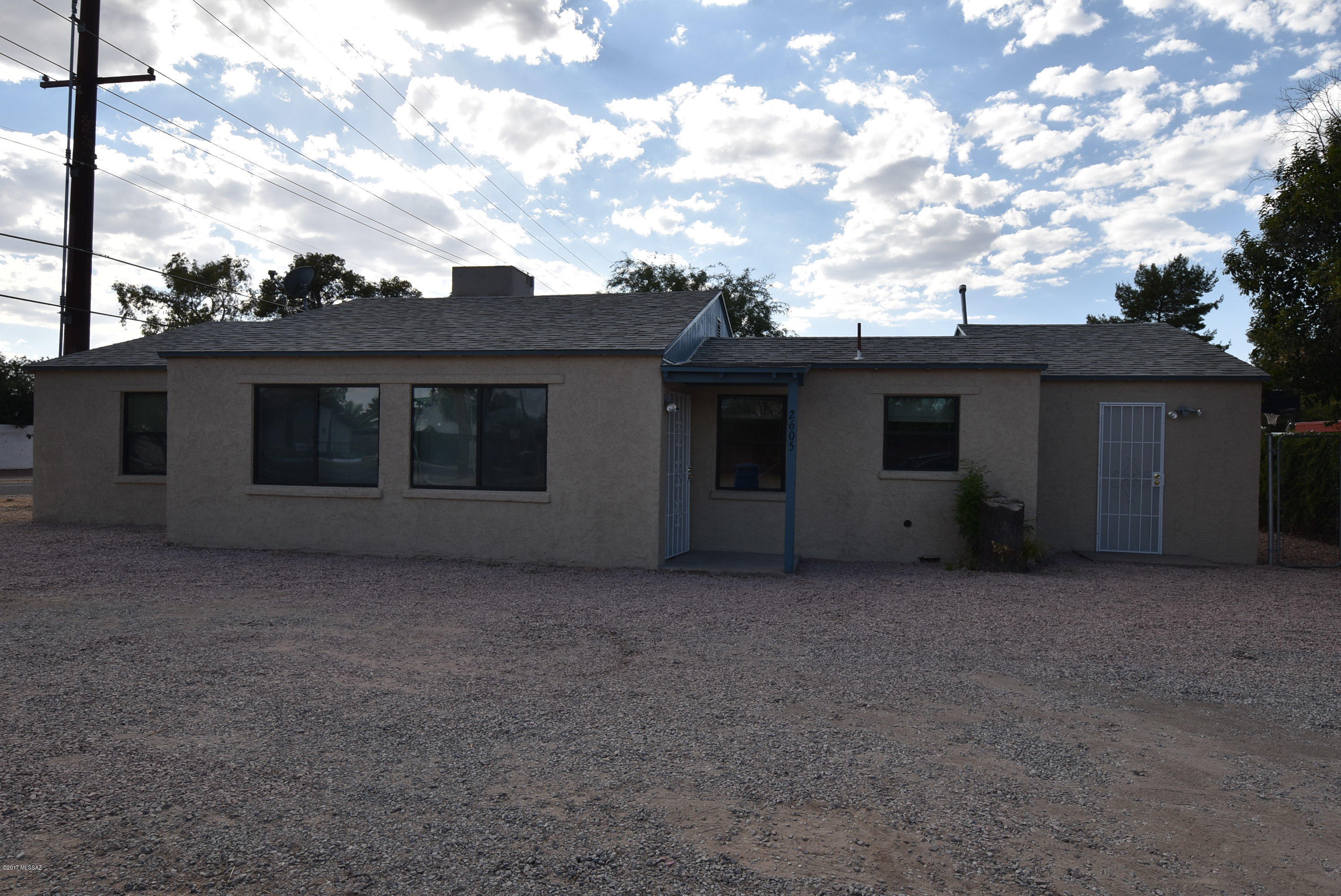 Centrally located 4 bedroom 2 bath home close to shopping, dining, and all the amenities Central Tucson has to offer. Tile flooring throughout - no carpet! Spacious living area, kitchen with ceramic tile counter tops, and additional storage with counter space and utility sink off the laundry area. Newer AC plus Ceiling fans in all the bedrooms and living room. Large fully fenced backyard with access to detached 1 car garage. Comfortable, clean home ready for move in. No smoking allowed. One year lease minimum. Renters insurance required. Subject to application process and credit approval. Call listing agent for additional information and requirements.