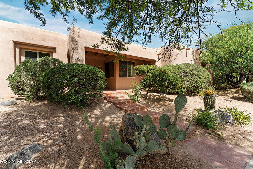 Prime Catalina Foothills location~tucked in at the end of a quiet cul-de-sac at the foot of the Catalinas. You'll be happy to find this first time on the market custom 4 bedroom home~featuring Saltillo flooring, beams, 2 fireplaces, tile accents and french doors. Bay window dining nook adds to the large open island kitchen over looking the family room.  Primary bedroom w/beehive fireplace, primary bathroom w/dual vanities, soaking tub, separate shower and generous walk-in closet. Expansive serene backyard w/covered brick paver patio, pool and spa surrounded by mature vegetation giving you the utmost privacy. Home is in need of updating, or would be good with some TLC~surrounded by more expensive homes. Minutes from Sabino Canyon, hiking trails, golf, shopping, and restaurants.