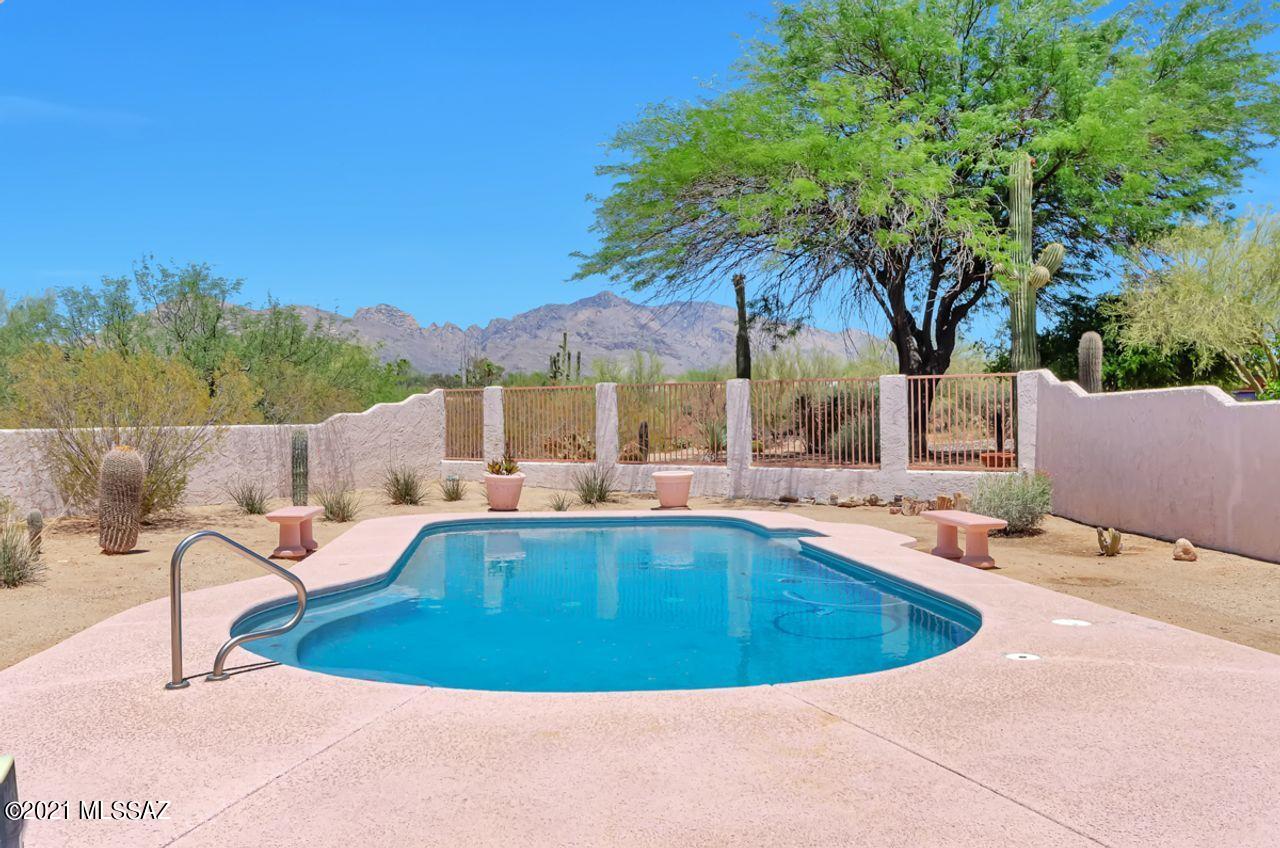 VIEWS! VIEWS! VIEWS! This 4 bd/3 ba.  home is situated on the corner of a quiet cul-de-sac with panoramic views of the Catalina Mountains from the large family room off the kitchen, & from the master bedroom. The home was built to take advantage of the best views of the mountains, especially from the pool & the cool North facing patio which stretches along the back of the house. The formal living/dining room is at the front of the home which is set back from the street with low care & native shrubs & trees. The circular driveway is off the quiet cul-de-sac, giving the home even more privacy. The master bedroom has an ensuite bathroom with a separate shower & garden tub. The 4th BR on the other side of the home also has an ensuite bathroom. There is a 9' x 15' bonus room off the garage. The bonus room which was the office for the model home, has vents so it could be heated and cooled. Listing agent is related to the Seller.