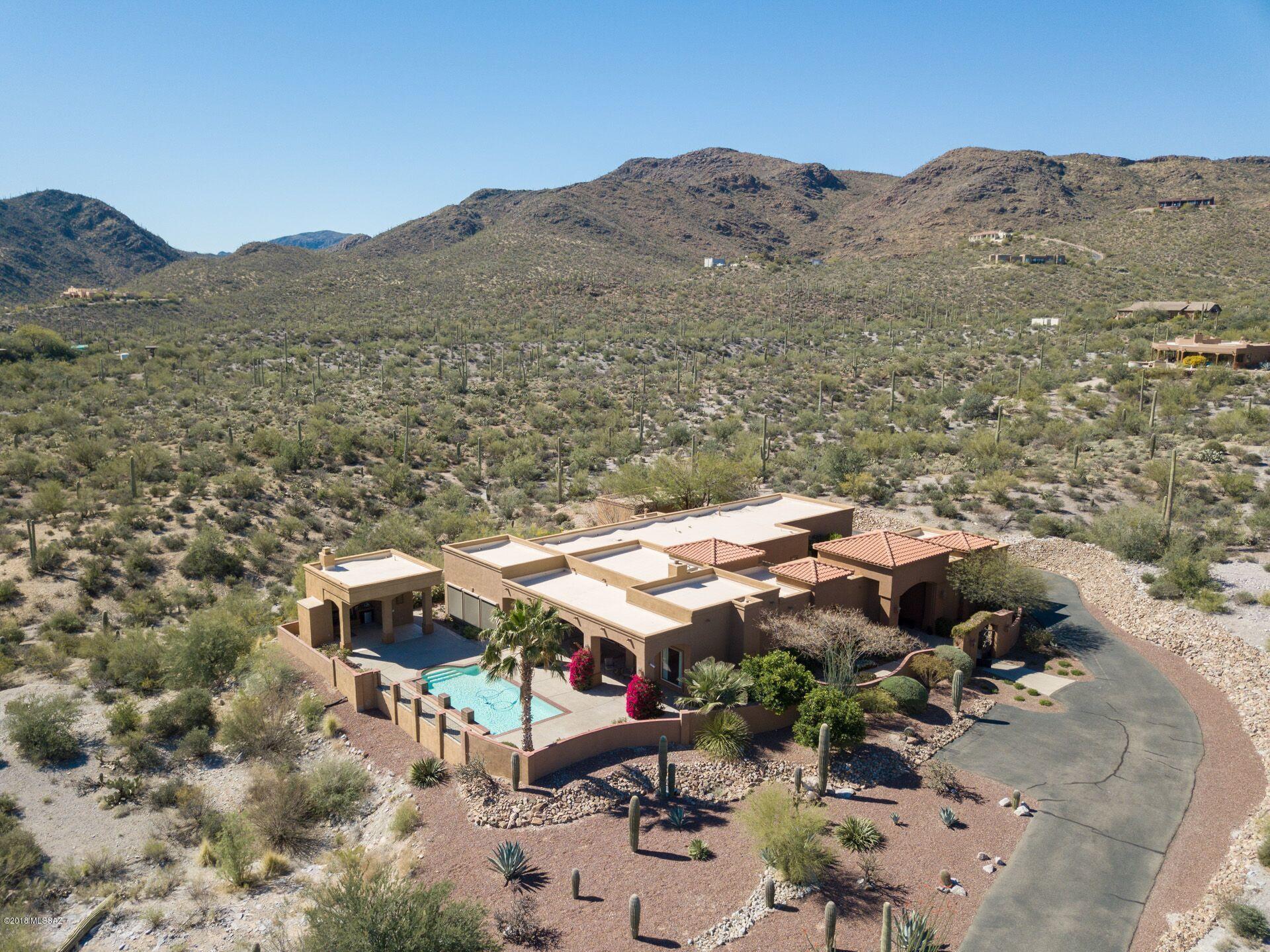 This spacious Sante Fe style custom built home is sprawled out over 3 acres on the West side of Tucson. This cozy home is surrounded with privacy as you can relax in one of the 2 courtyards.The open floor plan in the 4,110 sq ft main house boasts 5 bedrooms and 4 full bathrooms with a 410 sq ft casita that has a private gated entrance with 1 bedroom and 1 full bathroom.The kitchen is equipped with a large Sub-Zero refrigerator,6-burner stove top, double ovens with granite counters with large cabinets.Enjoy the large family room off the kitchen with easy access to the patio and pool area.  Entertain guests in the Cabana which has its own half bathroom and fireplace overlooking the city. Seller will accept or counter offers between $750000-$777000. The master bedroom has his/her closets, jacuzzi tub, walk-in shower, and dual sink vanities.